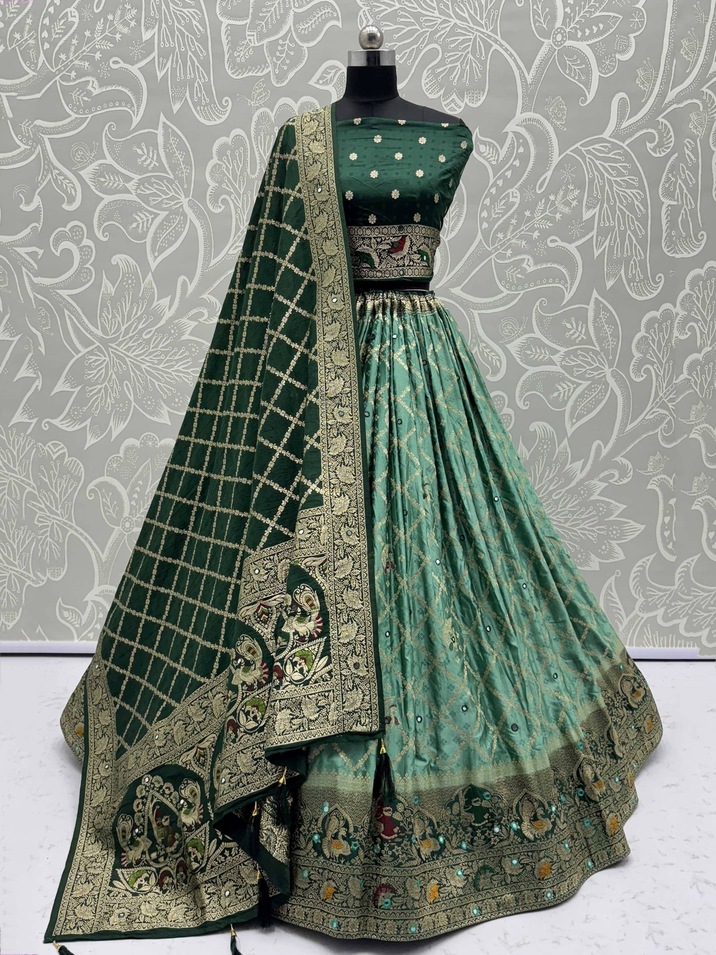 Emerald green designer lehenga choli with gold embroidery and peacock motifs, perfect for weddings and festive occasions.