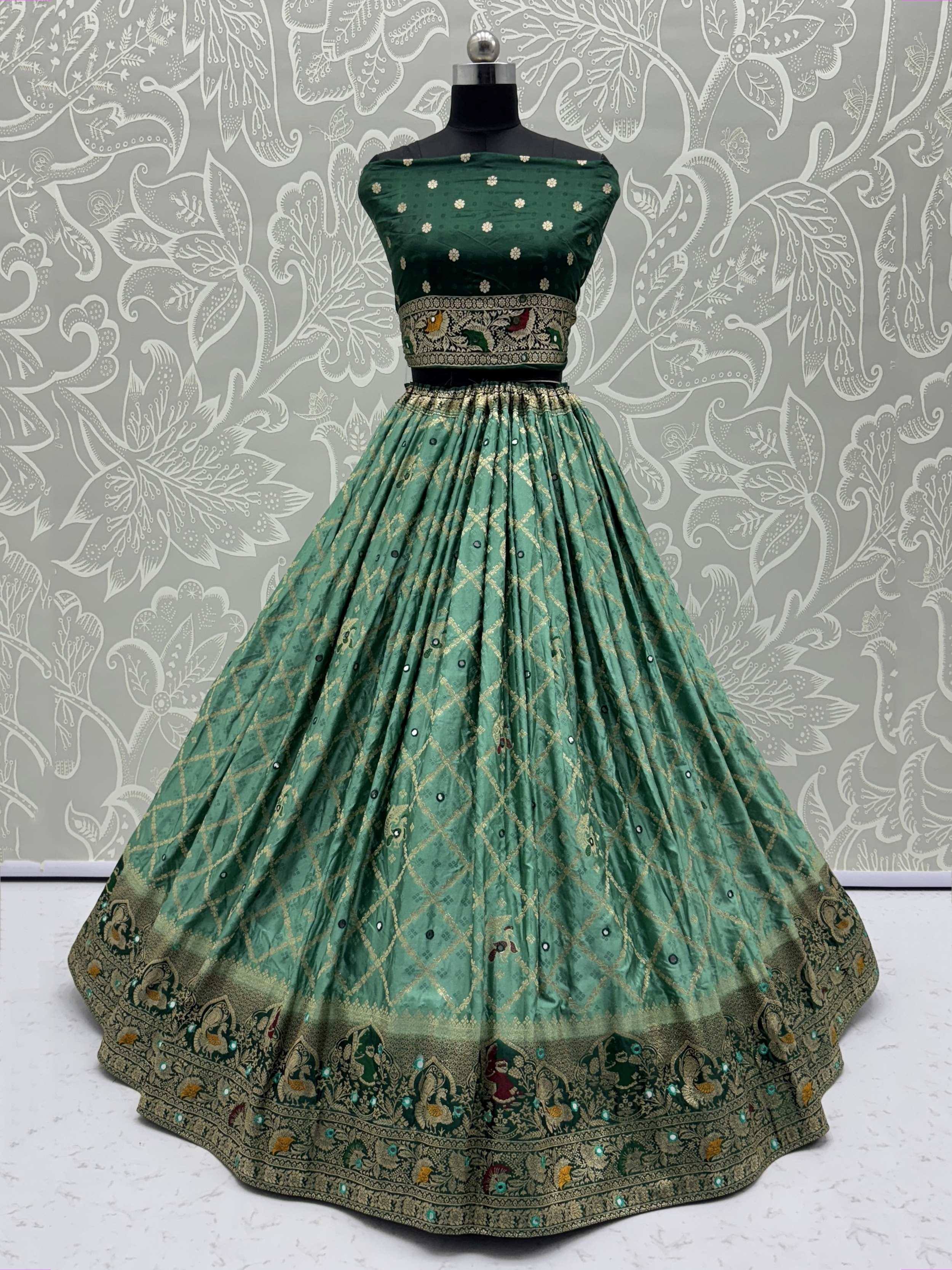 Emerald green designer lehenga choli with gold embroidery and peacock motifs, perfect for Indian ethnic wear