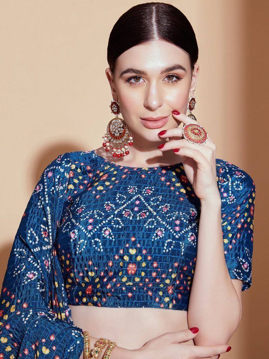 Blue floral print ethnic crop top with statement earrings and ring, perfect for Indian festive wear