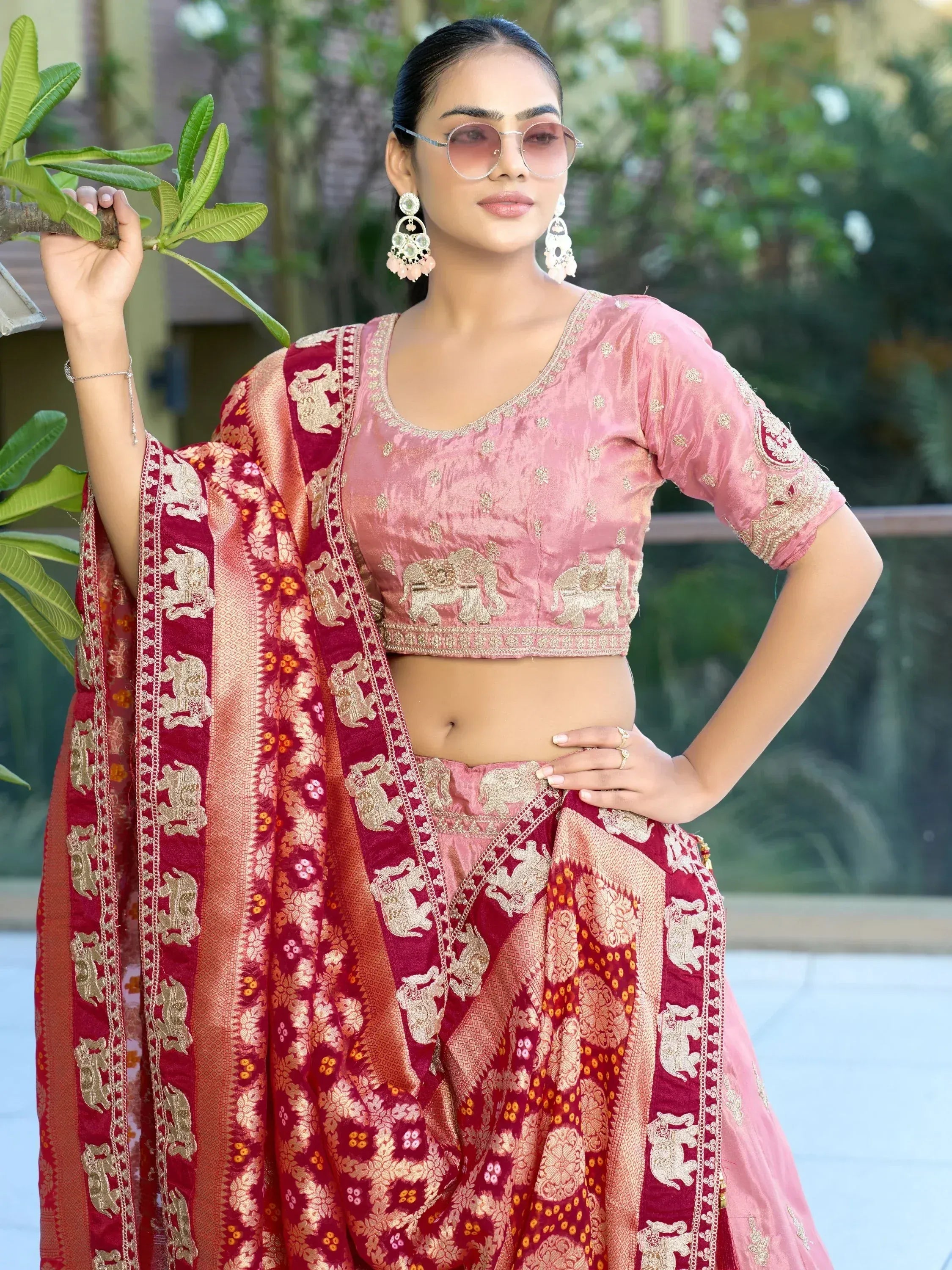 Pink and maroon designer lehenga choli with elephant embroidery, perfect for Indian ethnic wear occasions
