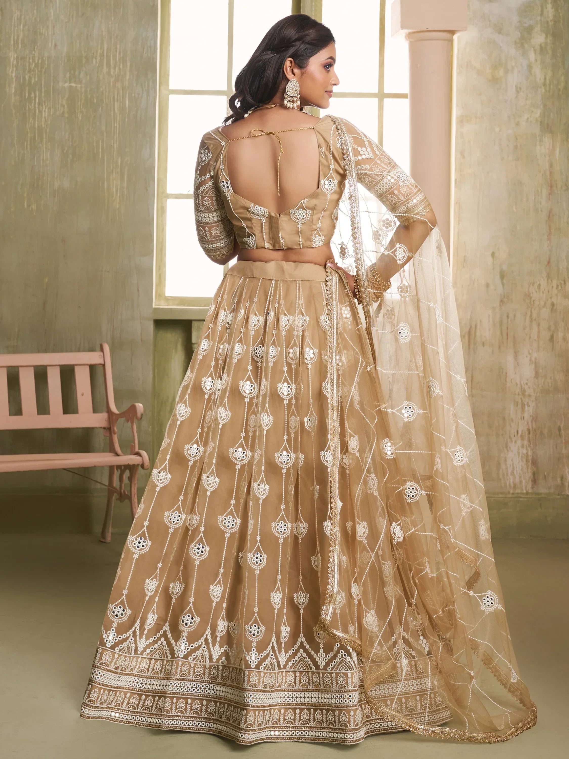Beige designer lehenga choli with mirror work and sheer dupatta, ethnic Indian wear for weddings