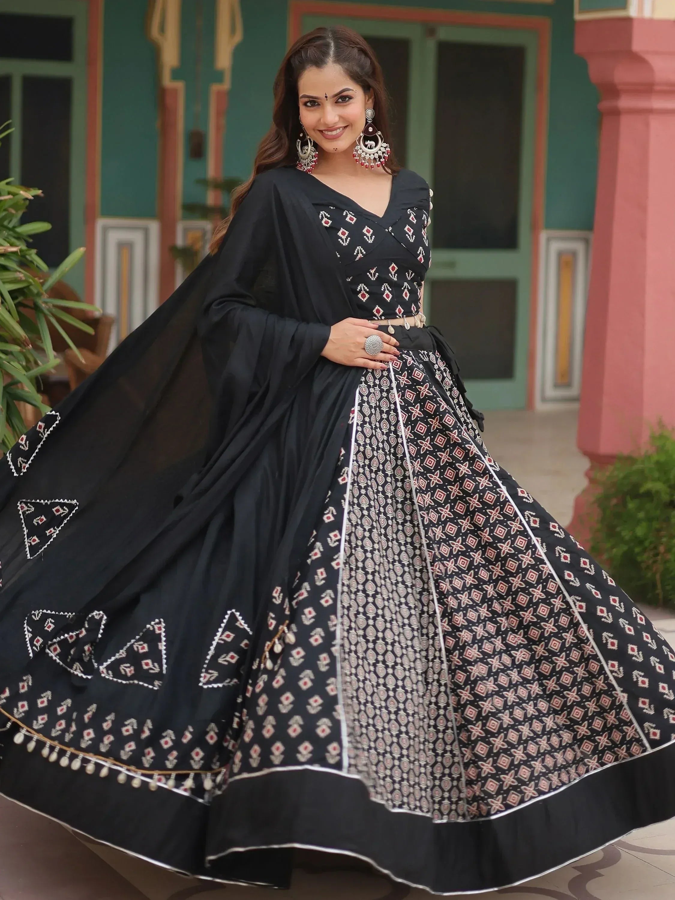 Black printed lehenga choli with ethnic embroidery, perfect for Indian weddings and festive occasions.