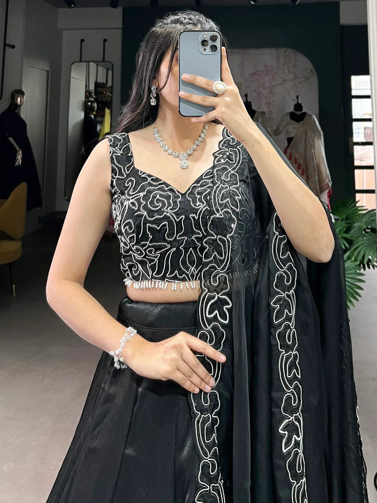 Black embroidered lehenga choli with white threadwork, perfect for Indian ethnic wear occasions