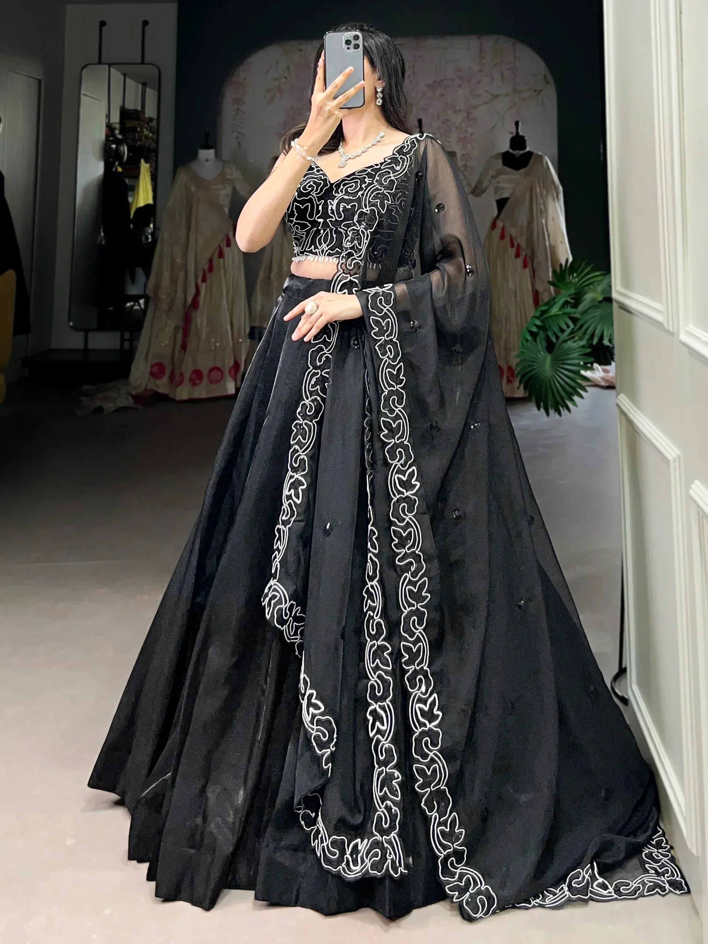 Black lehenga choli with white embroidery, sheer dupatta, designer Indian ethnic wear