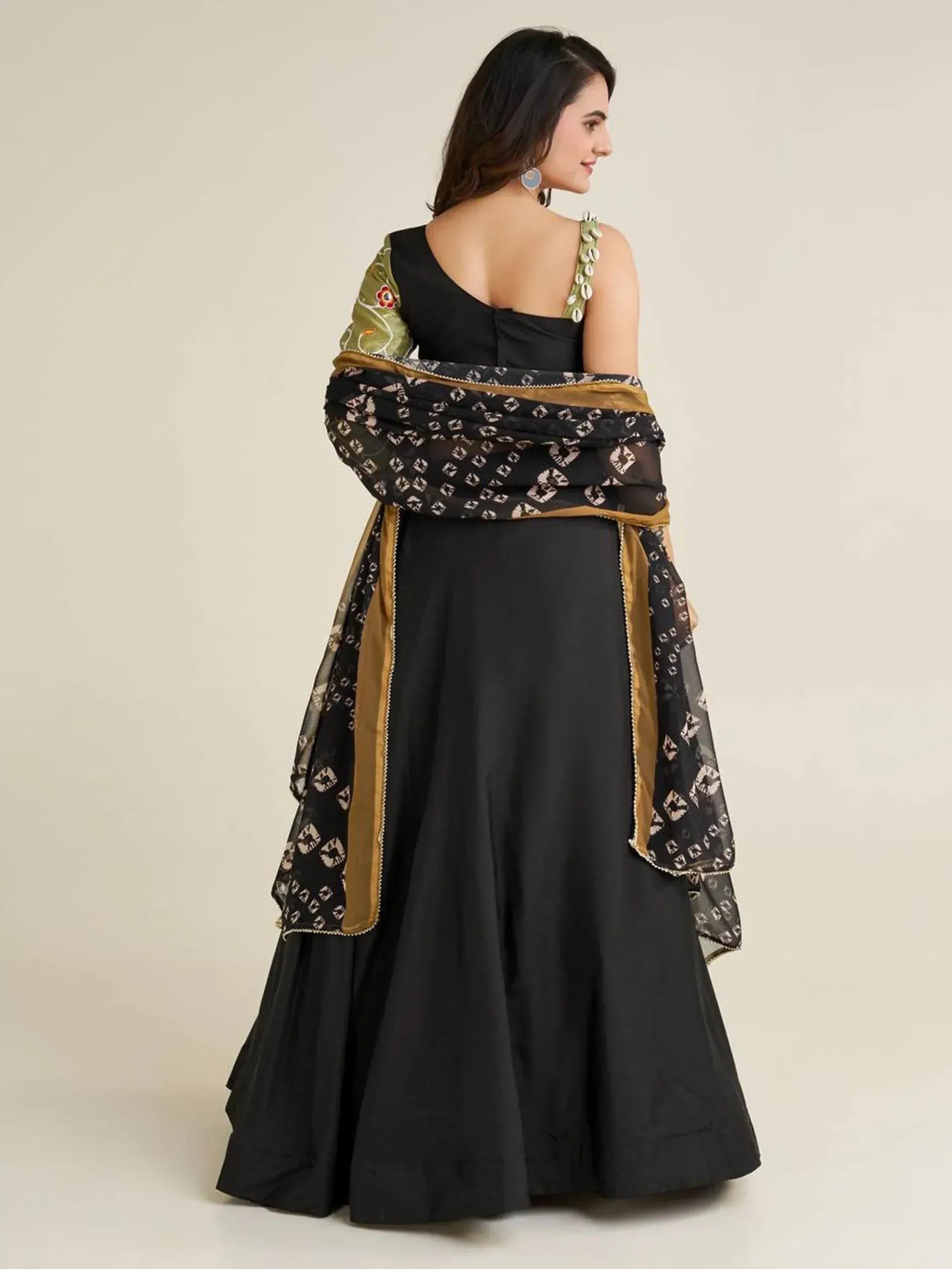 Black designer lehenga choli with embroidered green sleeves and printed dupatta, ethnic Indian wear
