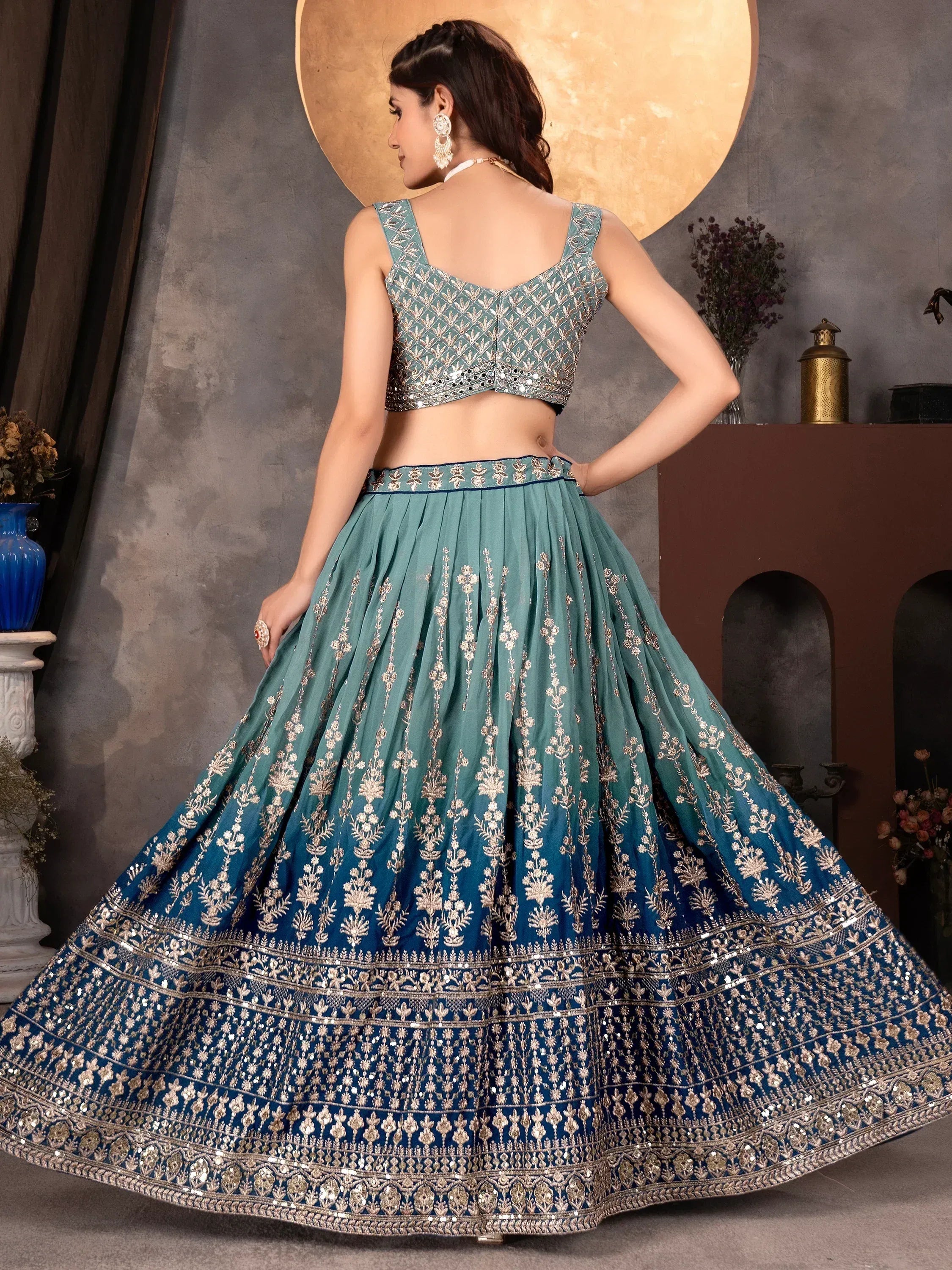 Teal blue embroidered lehenga choli with gold floral work, perfect for Indian ethnic occasions