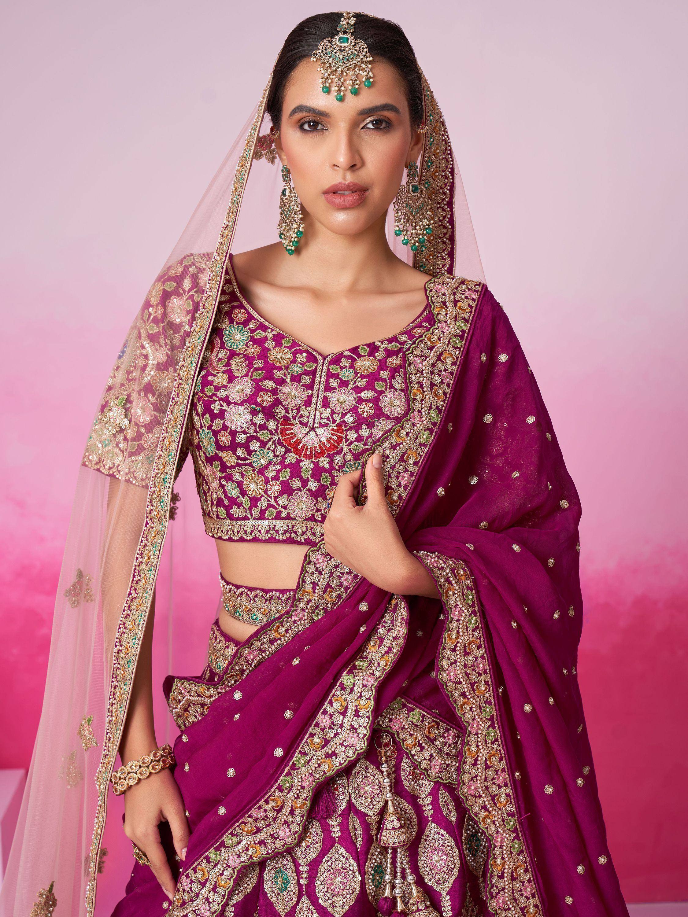 Elegant purple lehenga choli with floral embroidery, perfect for Indian weddings and festive occasions.