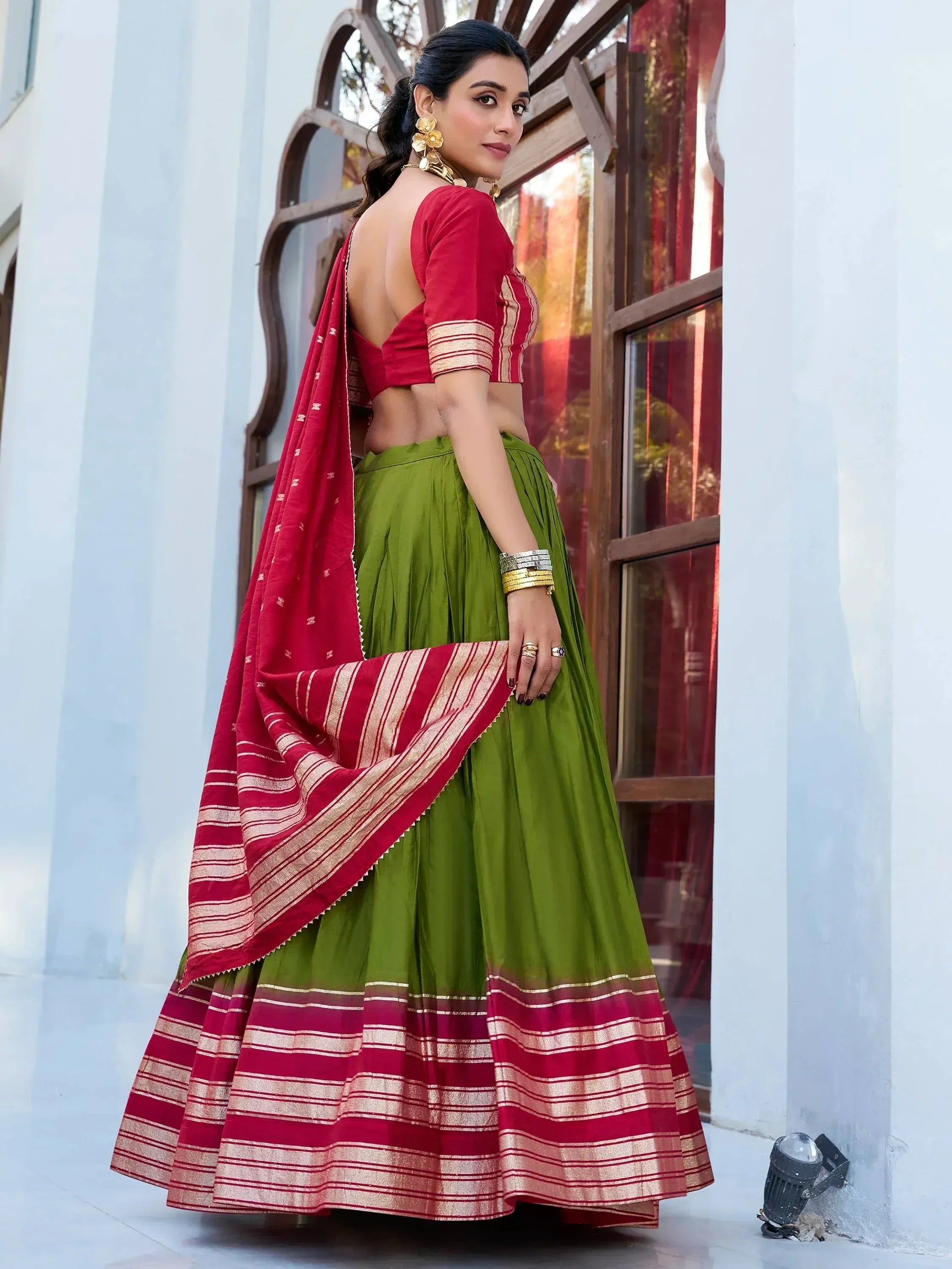 Green and red lehenga choli with gold stripes, backless blouse, ethnic Indian wear