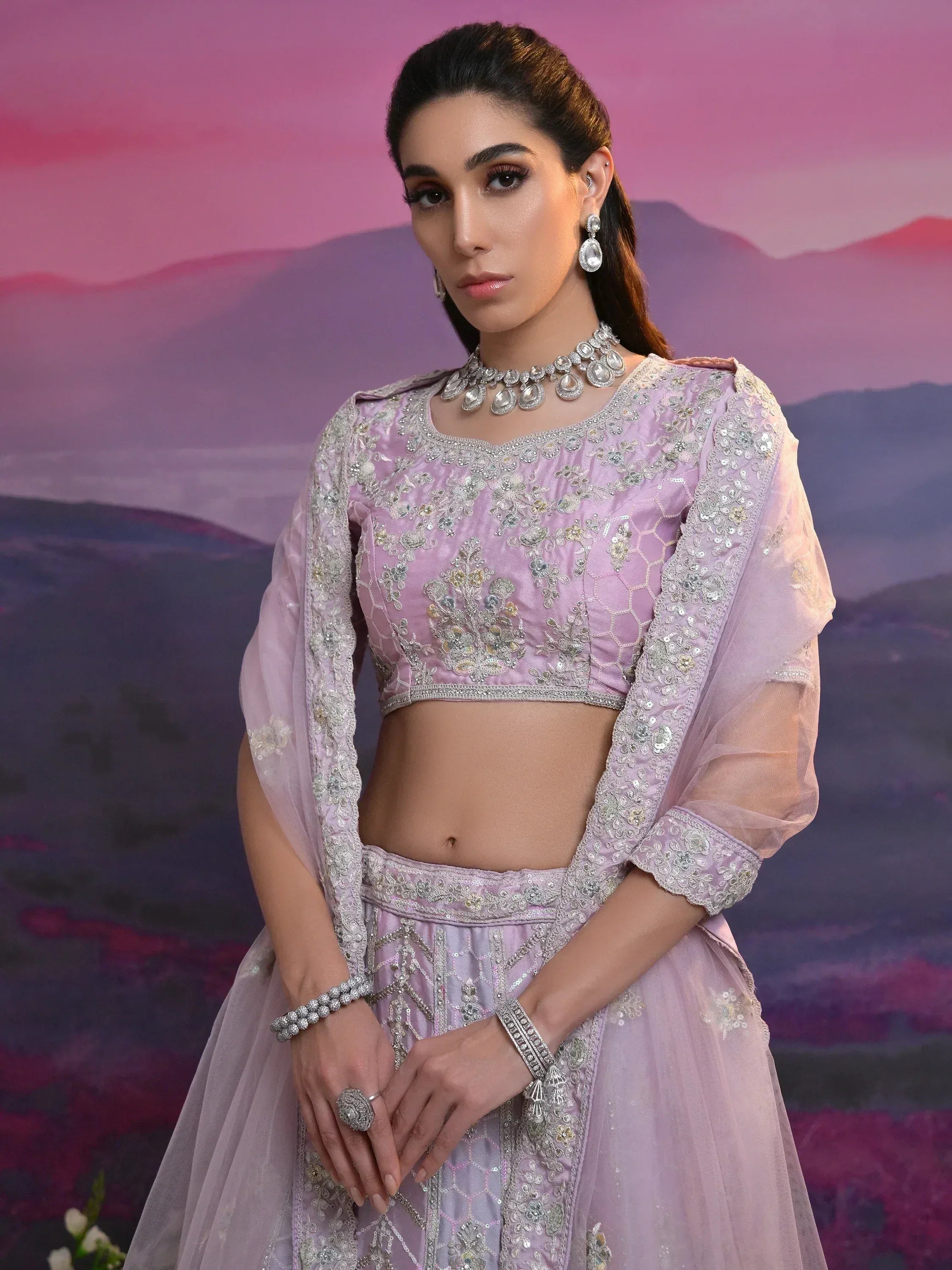 Elegant lavender lehenga choli with intricate embroidery and embellishments, perfect for Indian ethnic wear occasions.
