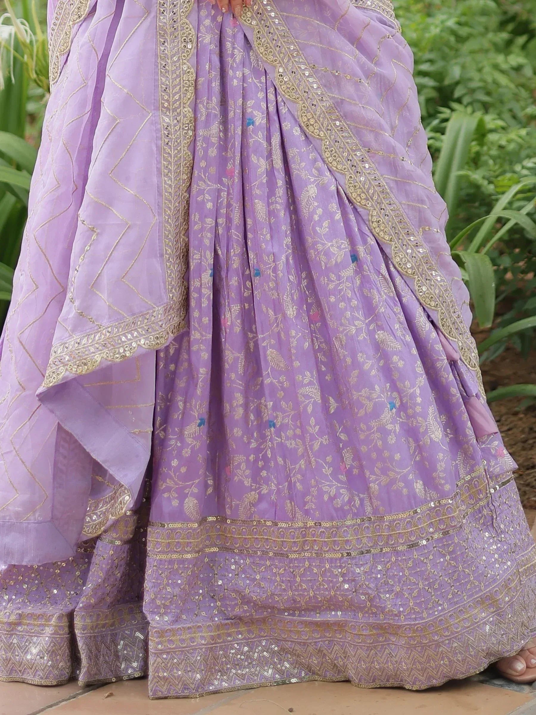 Lavender lehenga choli with gold embroidery and sequin detailing, perfect for Indian ethnic wear occasions.