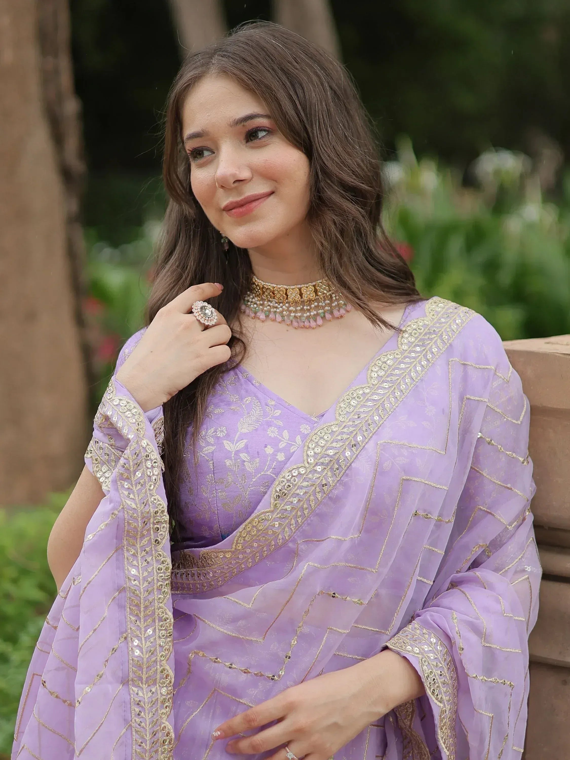 Lavender ethnic gown with gold embroidery, perfect for Indian occasions and festive wear.