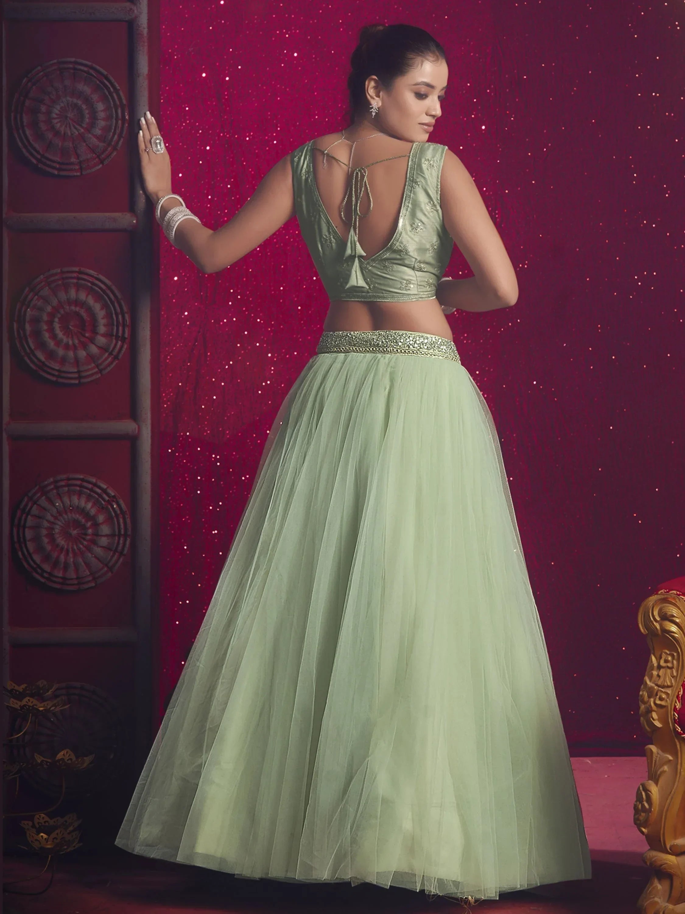 Mint green lehenga choli with embroidered blouse and tulle skirt, perfect for Indian ethnic occasions