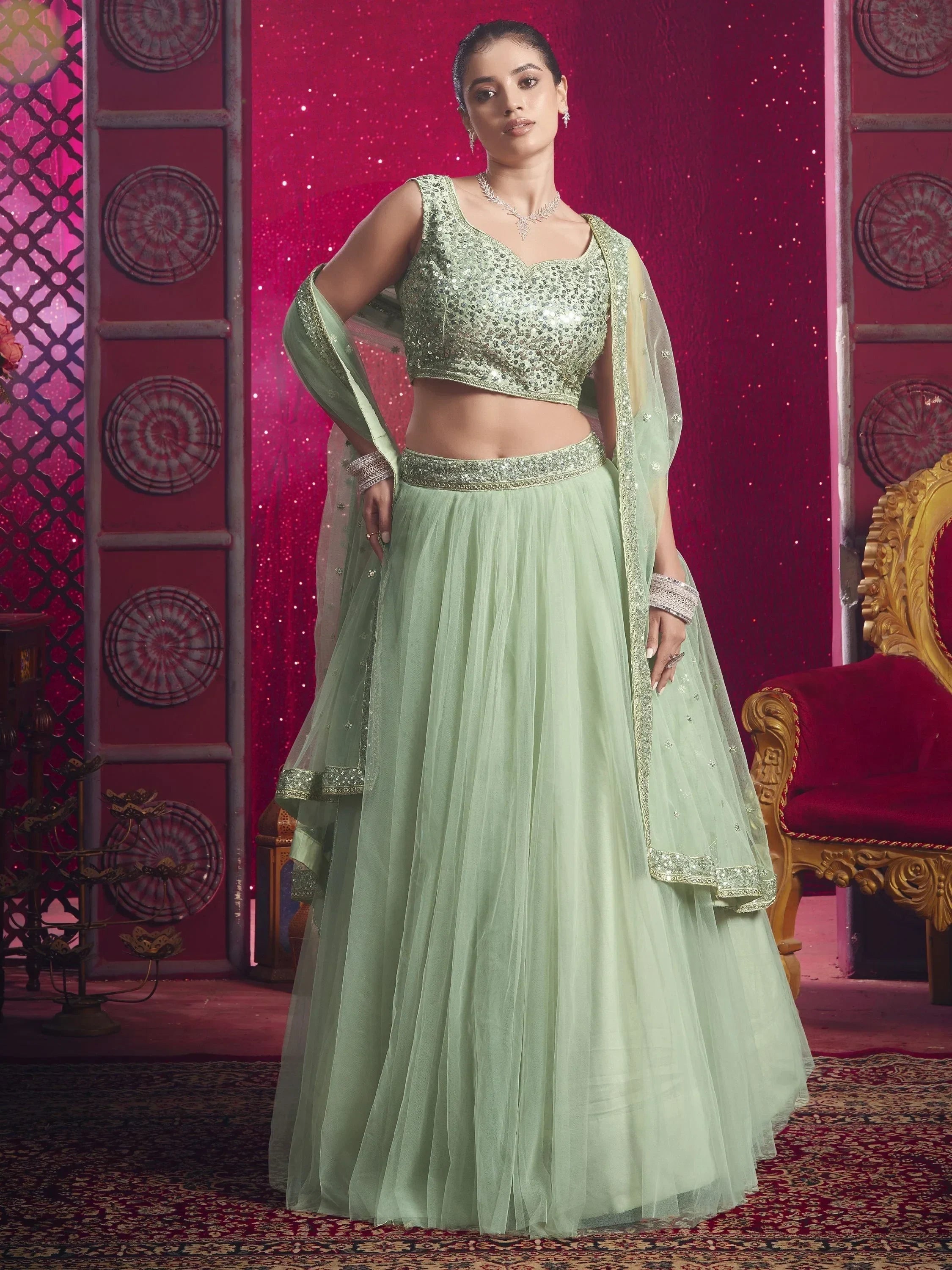 Mint green sequin lehenga choli with sheer dupatta, perfect for Indian ethnic wear and festive occasions.
