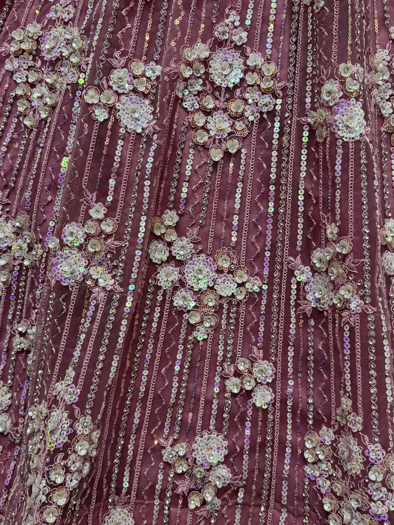 Dusty pink ethnic gown with floral sequin and bead embroidery, perfect for Indian weddings or parties.