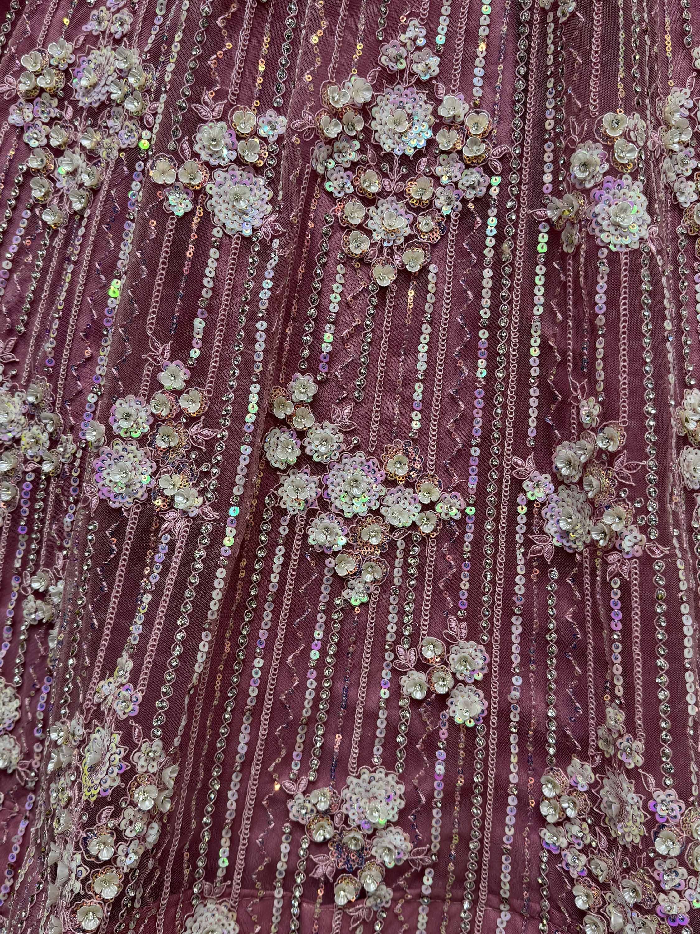 Dusty pink ethnic gown with floral sequin and bead embroidery, perfect for Indian weddings or parties.