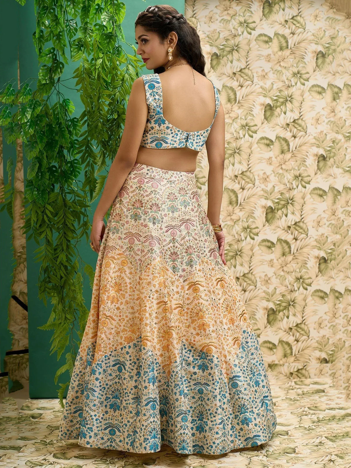 Floral print lehenga choli with blue and gold motifs, back view, ethnic wear for women