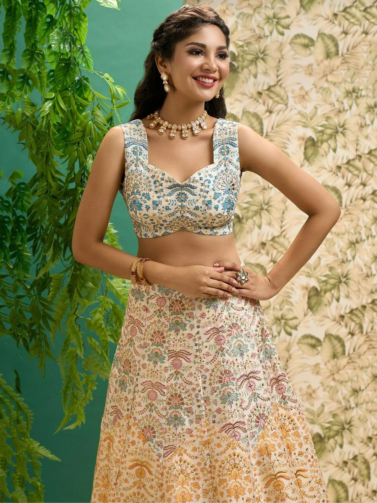 Woman in floral printed lehenga choli with blue embroidery, traditional Indian ethnic wear