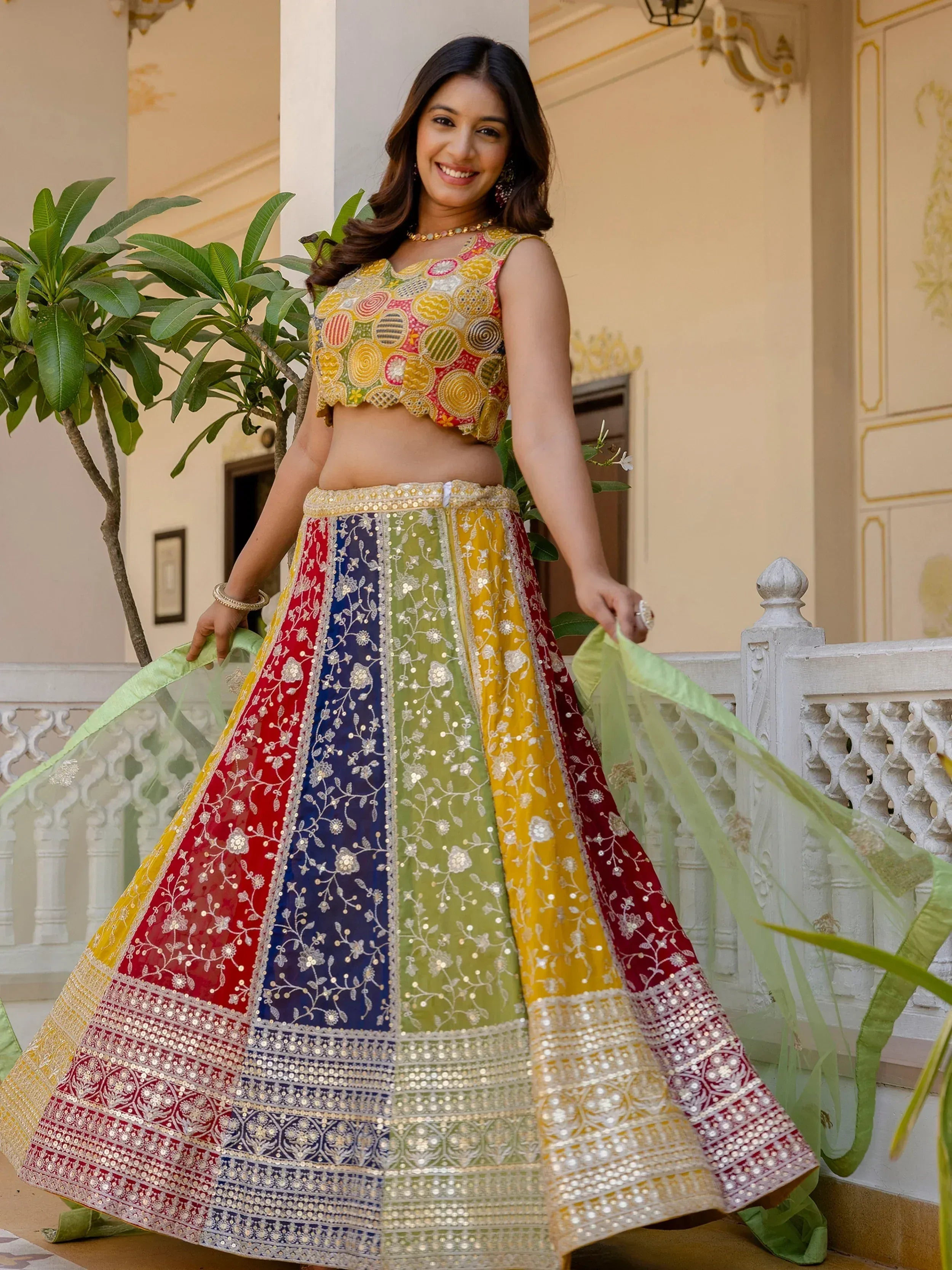 Colorful embroidered lehenga choli with floral patterns and mirror work, perfect for Indian ethnic wear