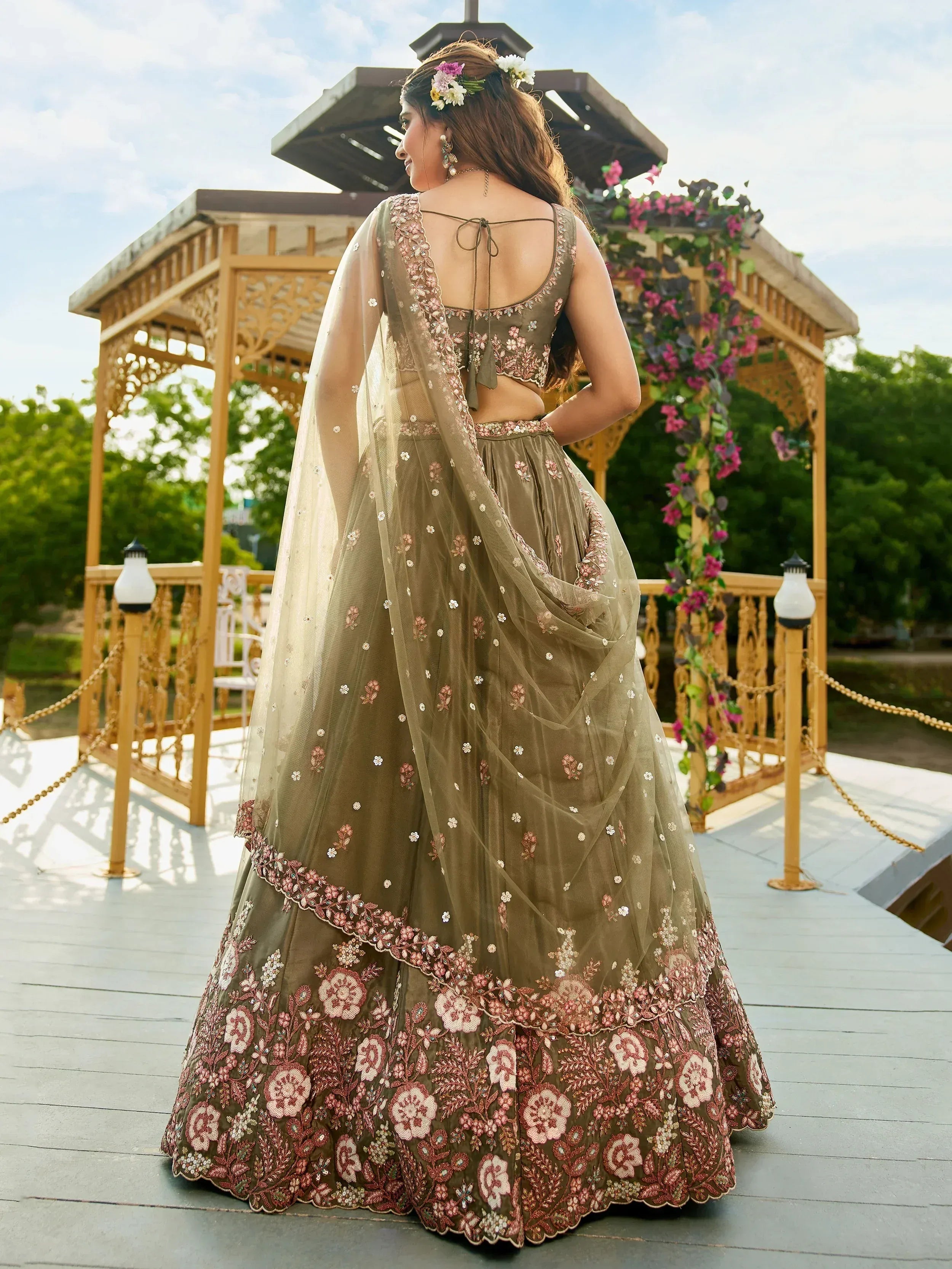 Elegant olive green lehenga choli with floral embroidery and sheer dupatta, perfect for Indian ethnic wear.