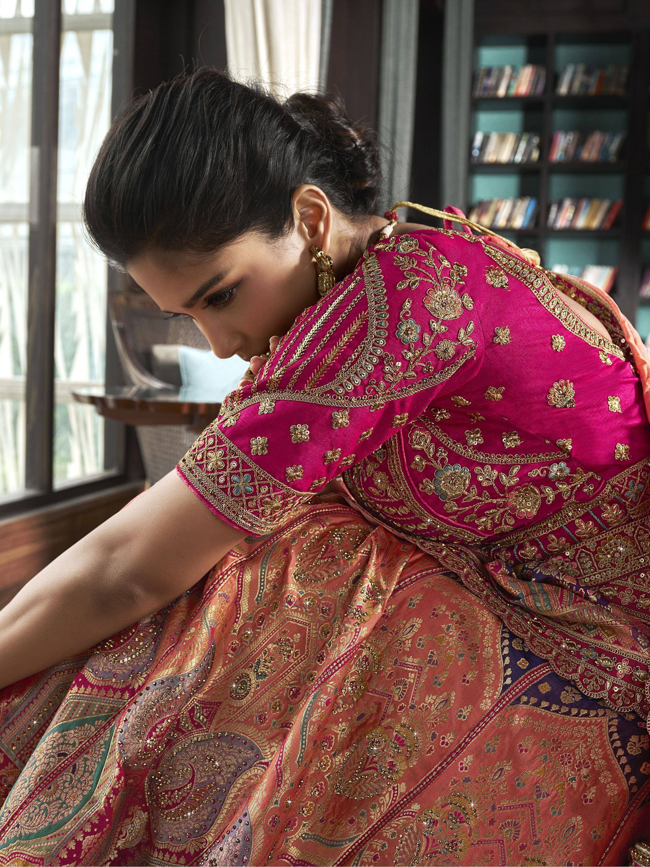 Elegant pink embroidered lehenga choli with gold floral detailing, perfect for Indian ethnic wear occasions.