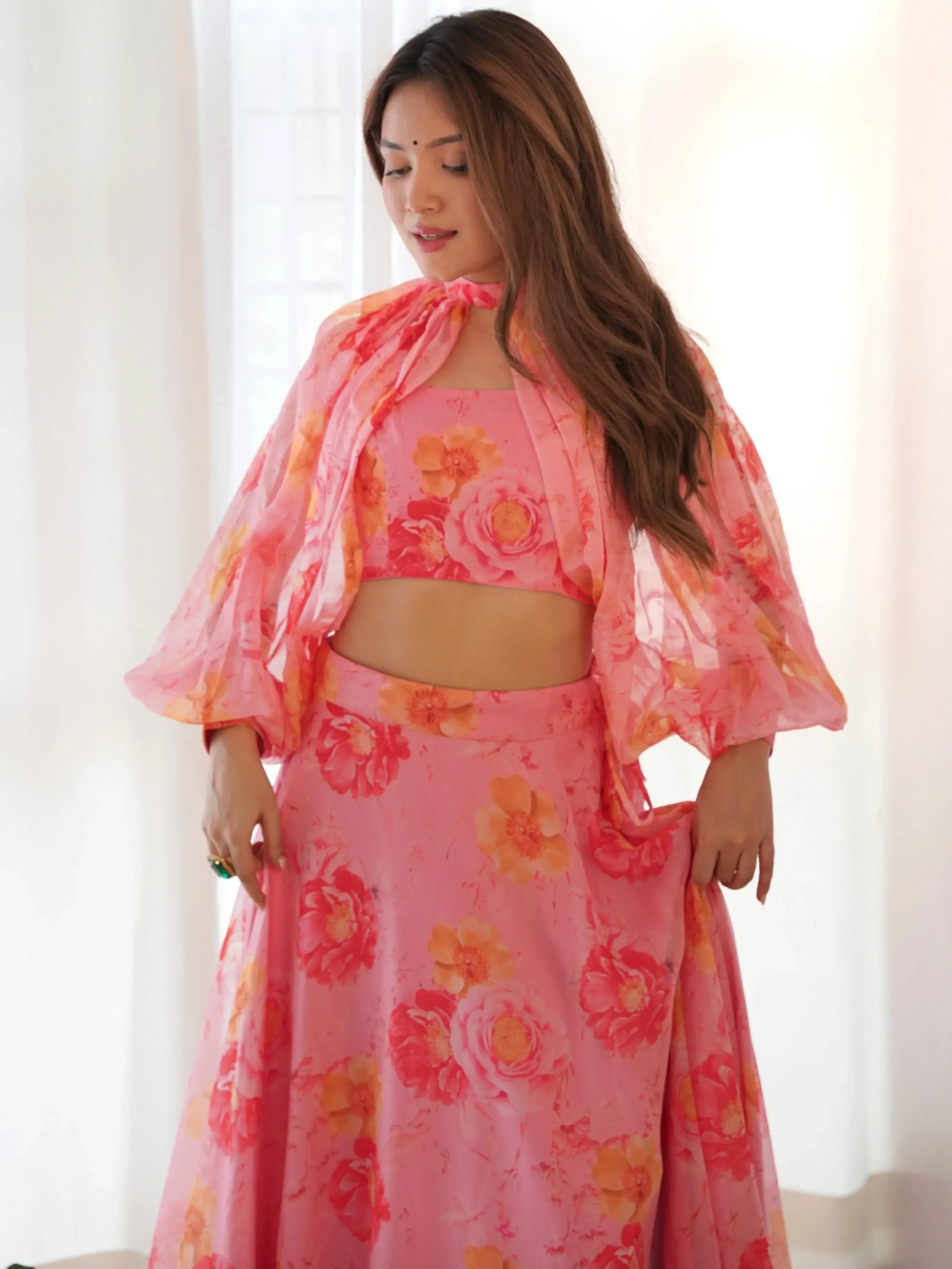 Pink floral ethnic gown with cape sleeves, perfect for Indian occasions and festive wear
