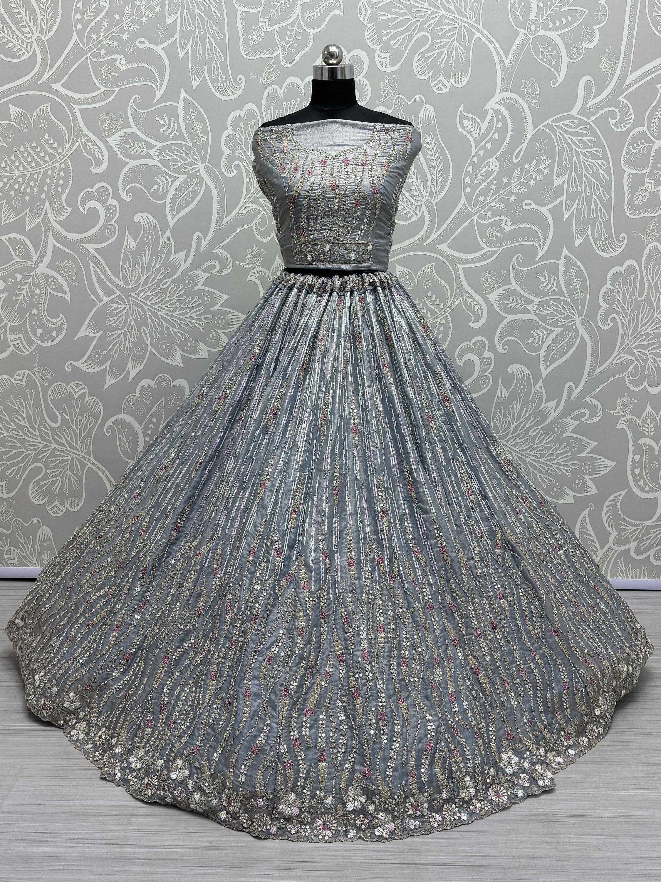 Grey designer lehenga choli with intricate embroidery and sequin work, perfect for Indian ethnic occasions.