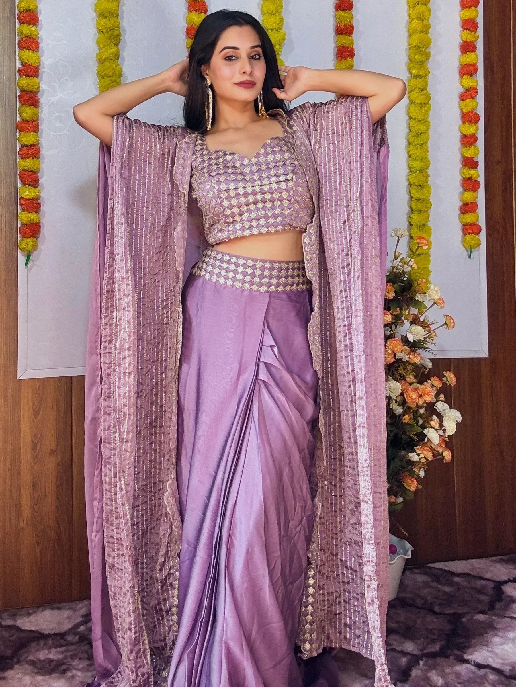 Lavender designer lehenga choli with gold embroidery and cape, perfect for Indian ethnic wear occasions
