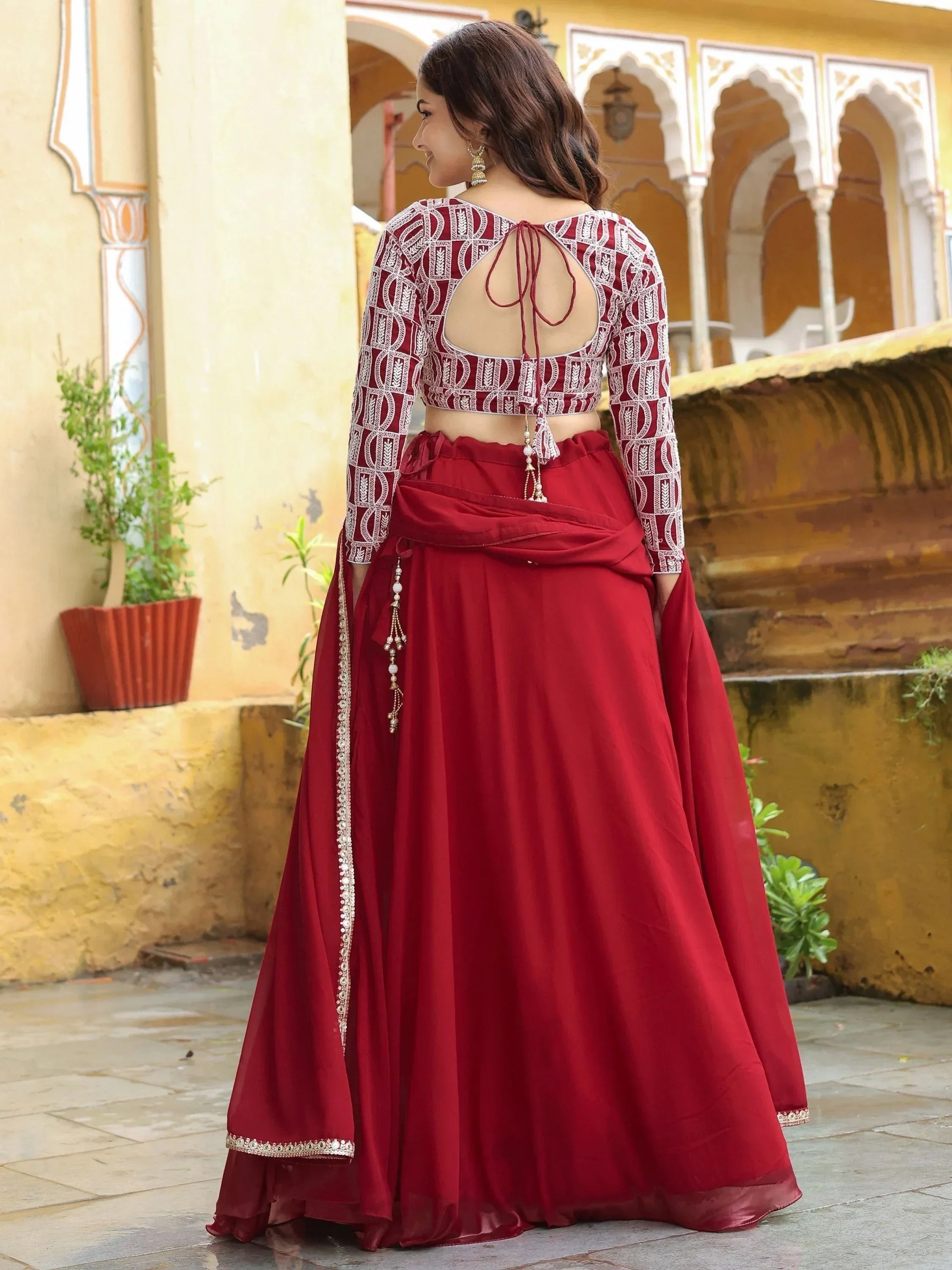 Maroon designer lehenga choli with white embroidery, back view, ethnic wear for women