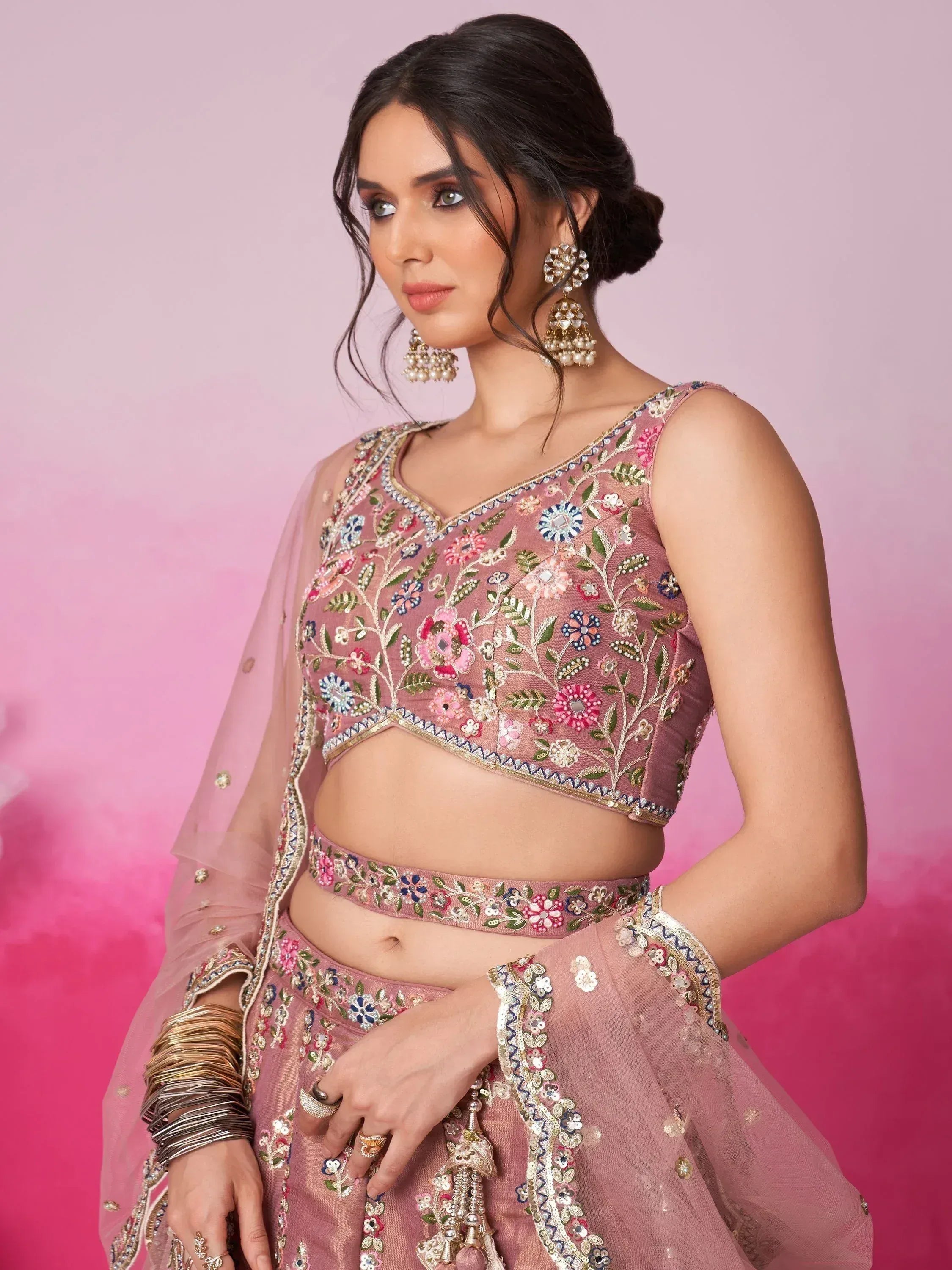 Pink floral embroidered lehenga choli with gold detailing, perfect for Indian ethnic wear occasions.