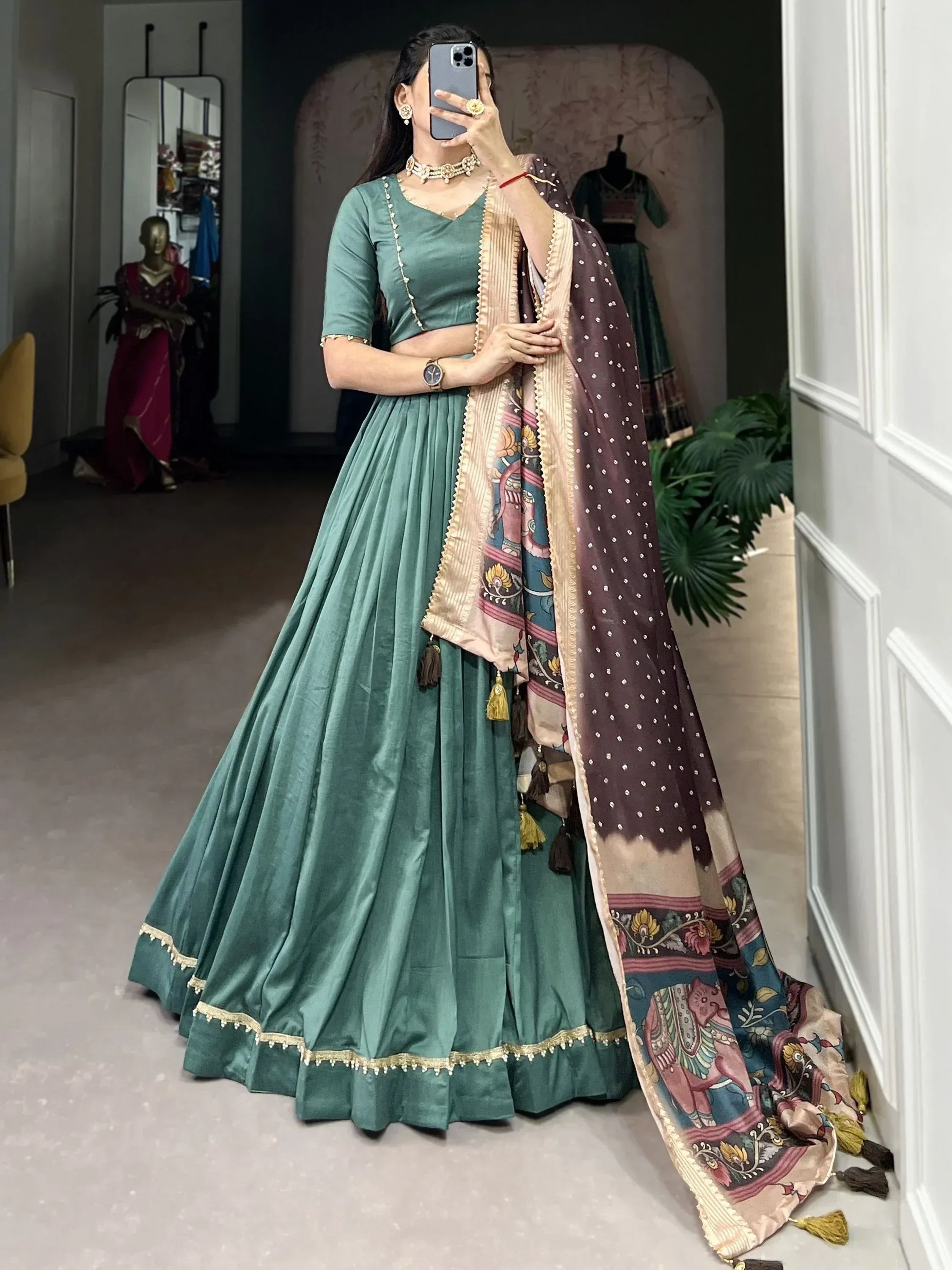 Teal green velvet lehenga choli with printed dupatta, ethnic Indian wear for weddings and festivals