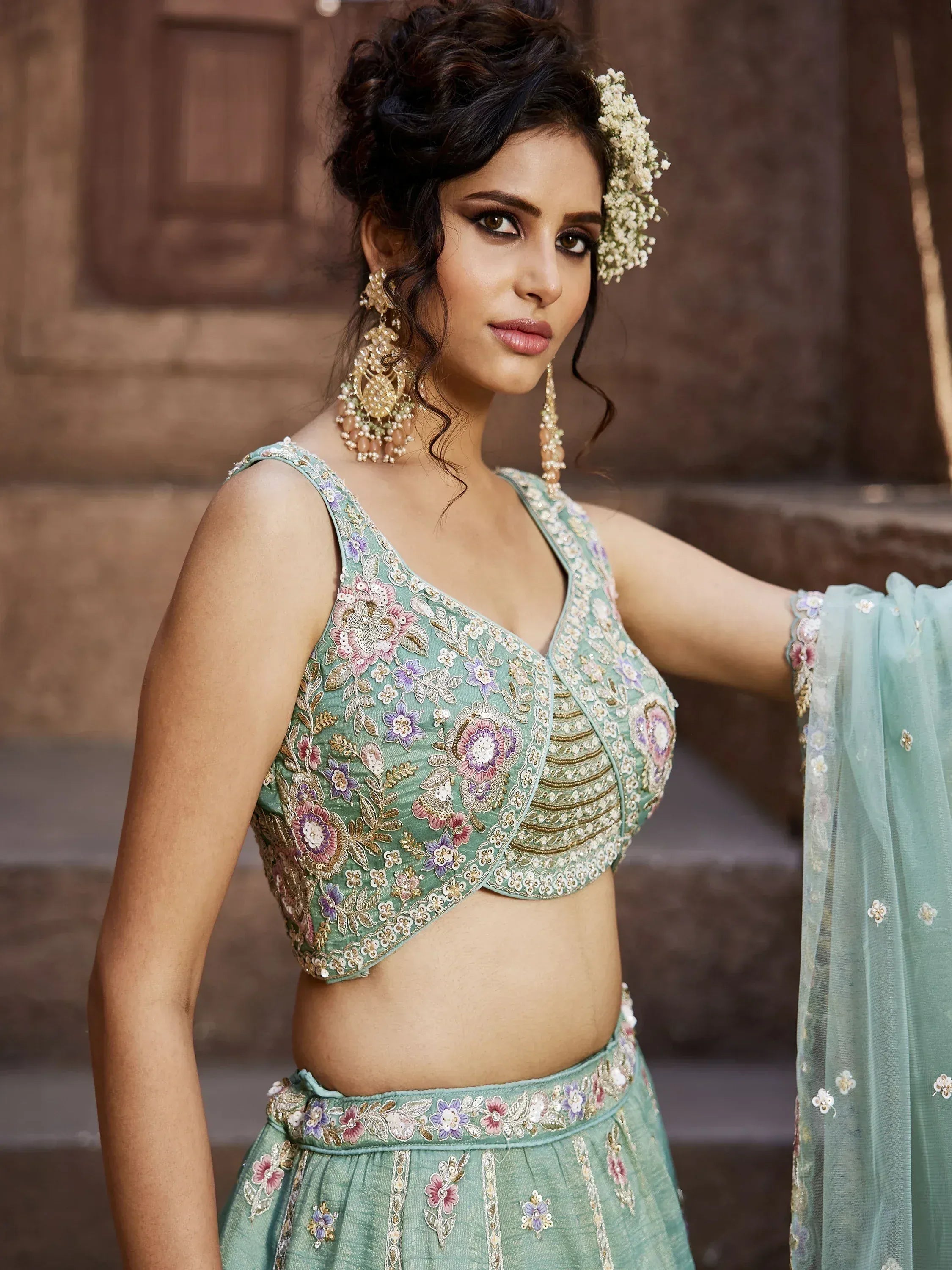Mint green embroidered lehenga choli with floral detailing, perfect for Indian ethnic wear occasions