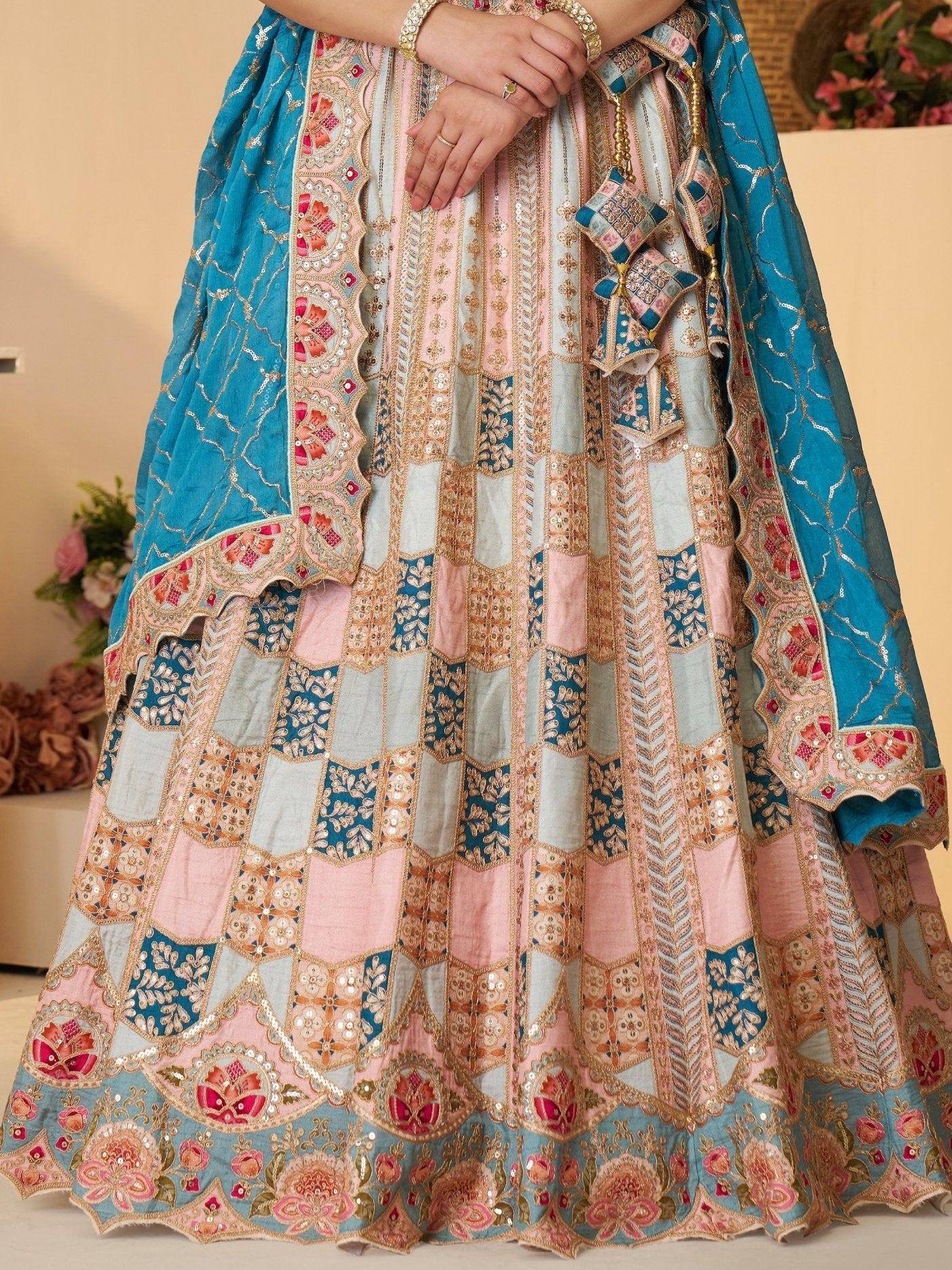 Designer lehenga choli with patchwork embroidery in blue and pink, perfect for Indian ethnic wear occasions