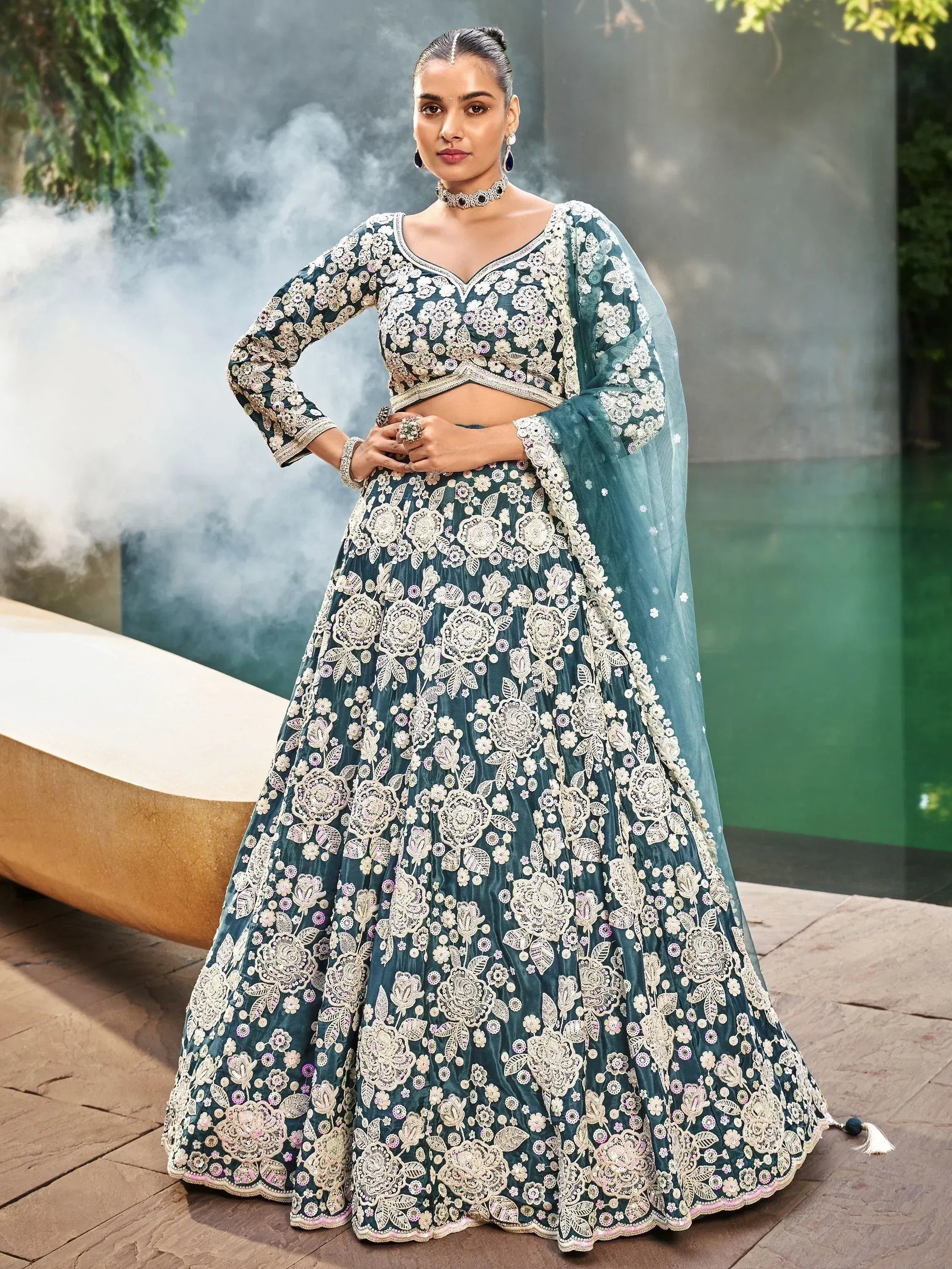 Teal floral embroidered lehenga choli with matching dupatta, perfect for Indian weddings and festive occasions