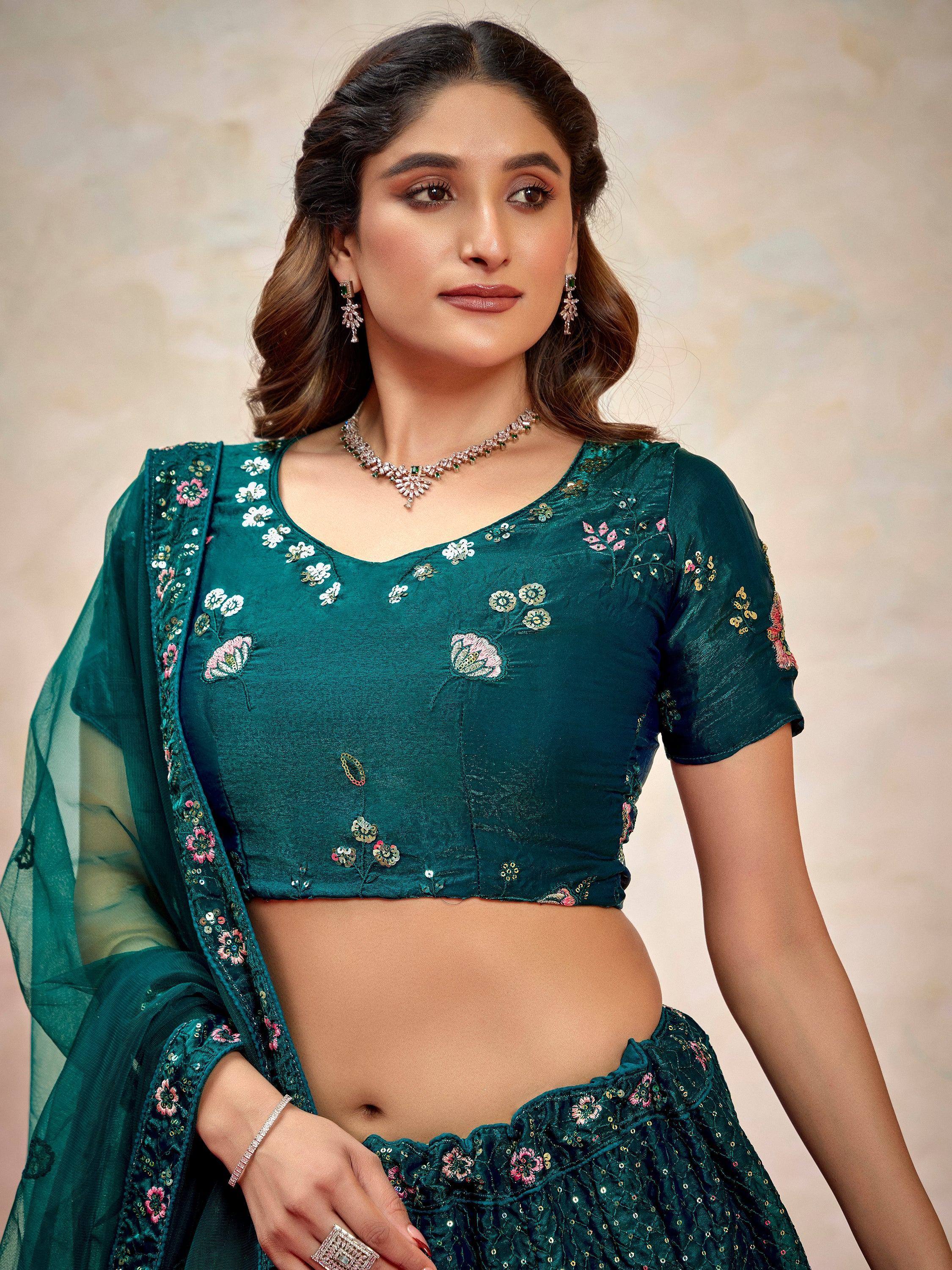 Emerald green embroidered lehenga choli with floral motifs and sheer dupatta, perfect for Indian ethnic occasions.