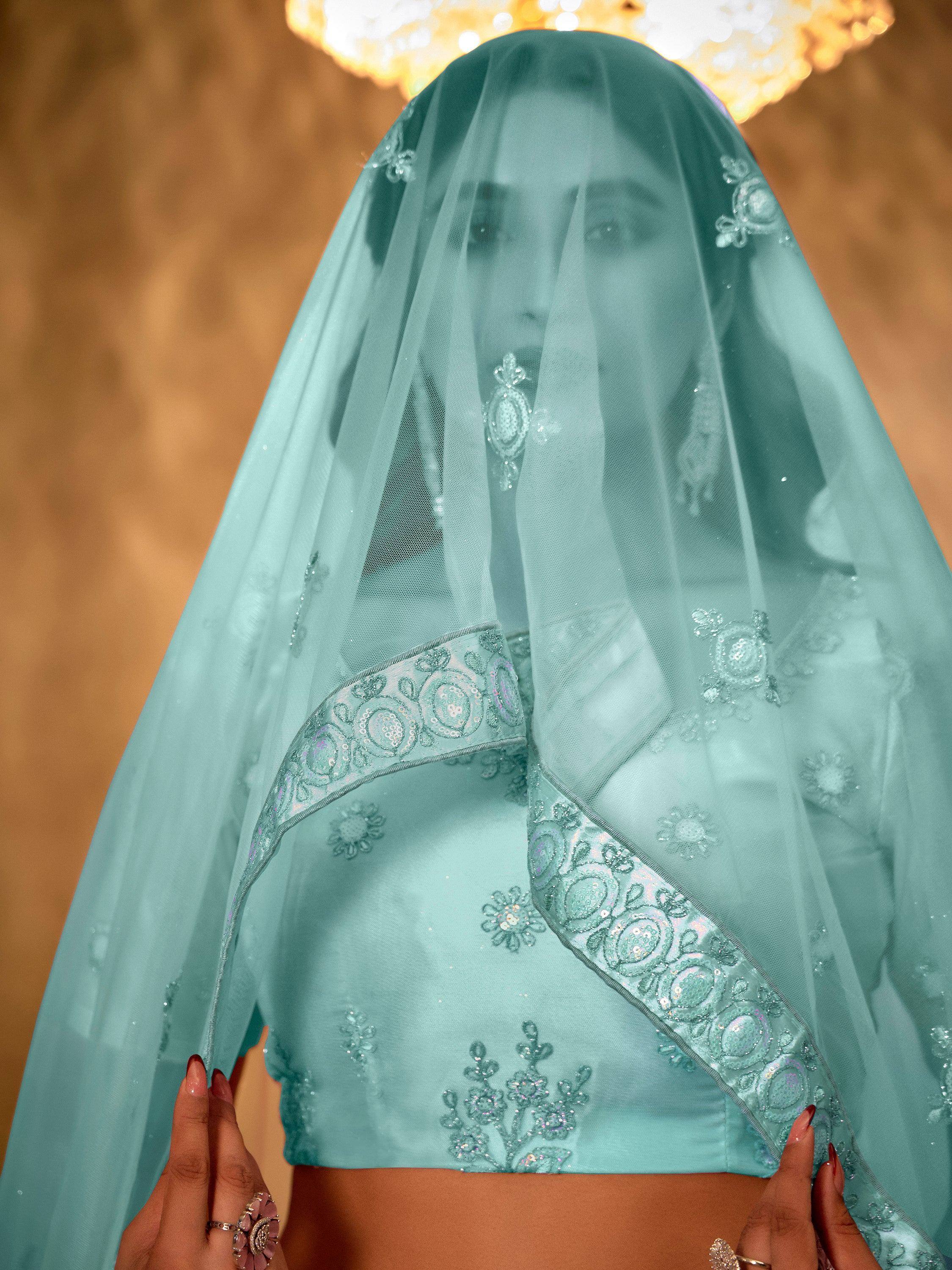 Mint green embroidered lehenga choli with sheer dupatta, perfect for Indian ethnic wear events