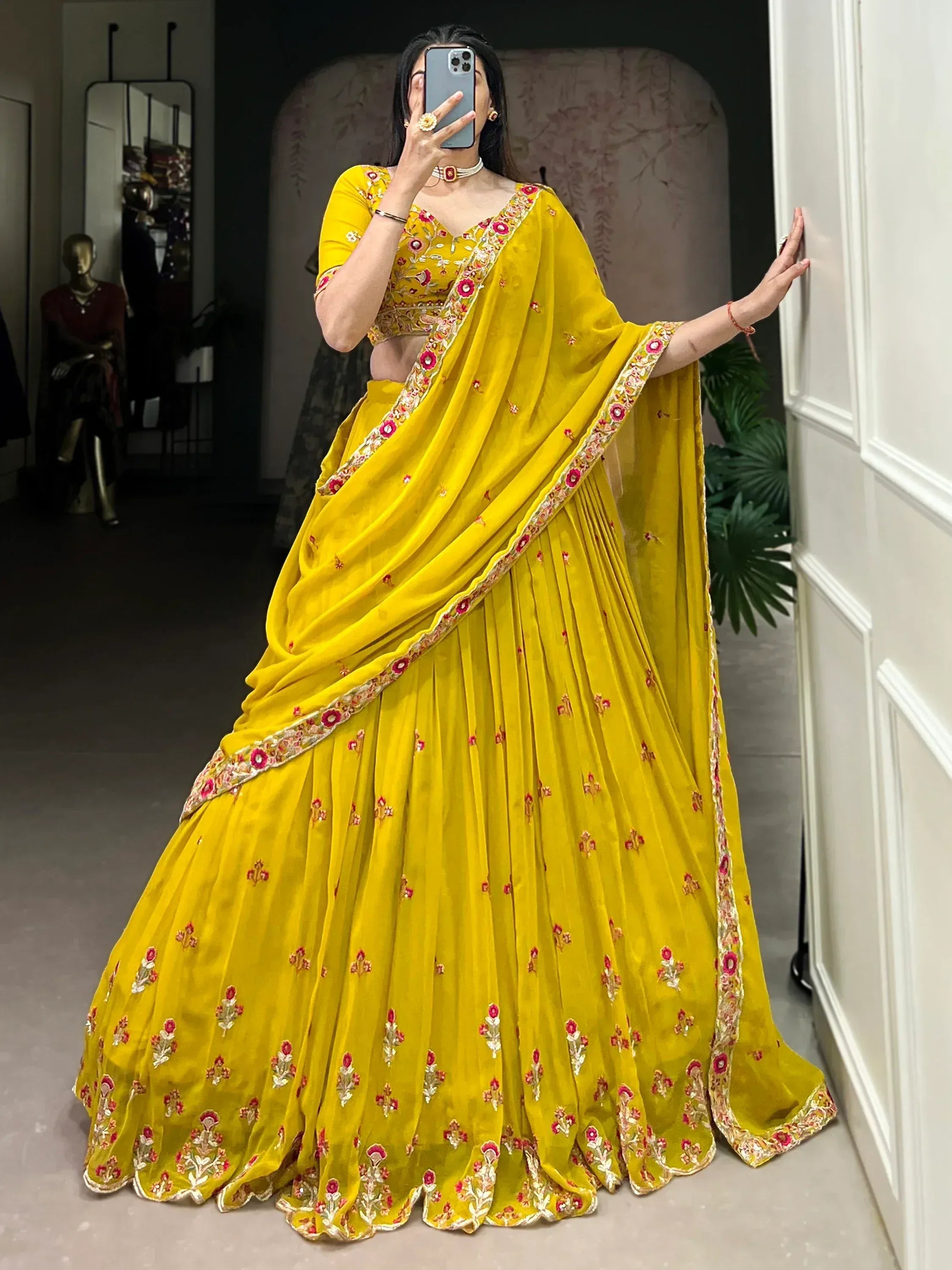 Vibrant yellow lehenga choli with floral embroidery, perfect for Indian ethnic wear occasions.
