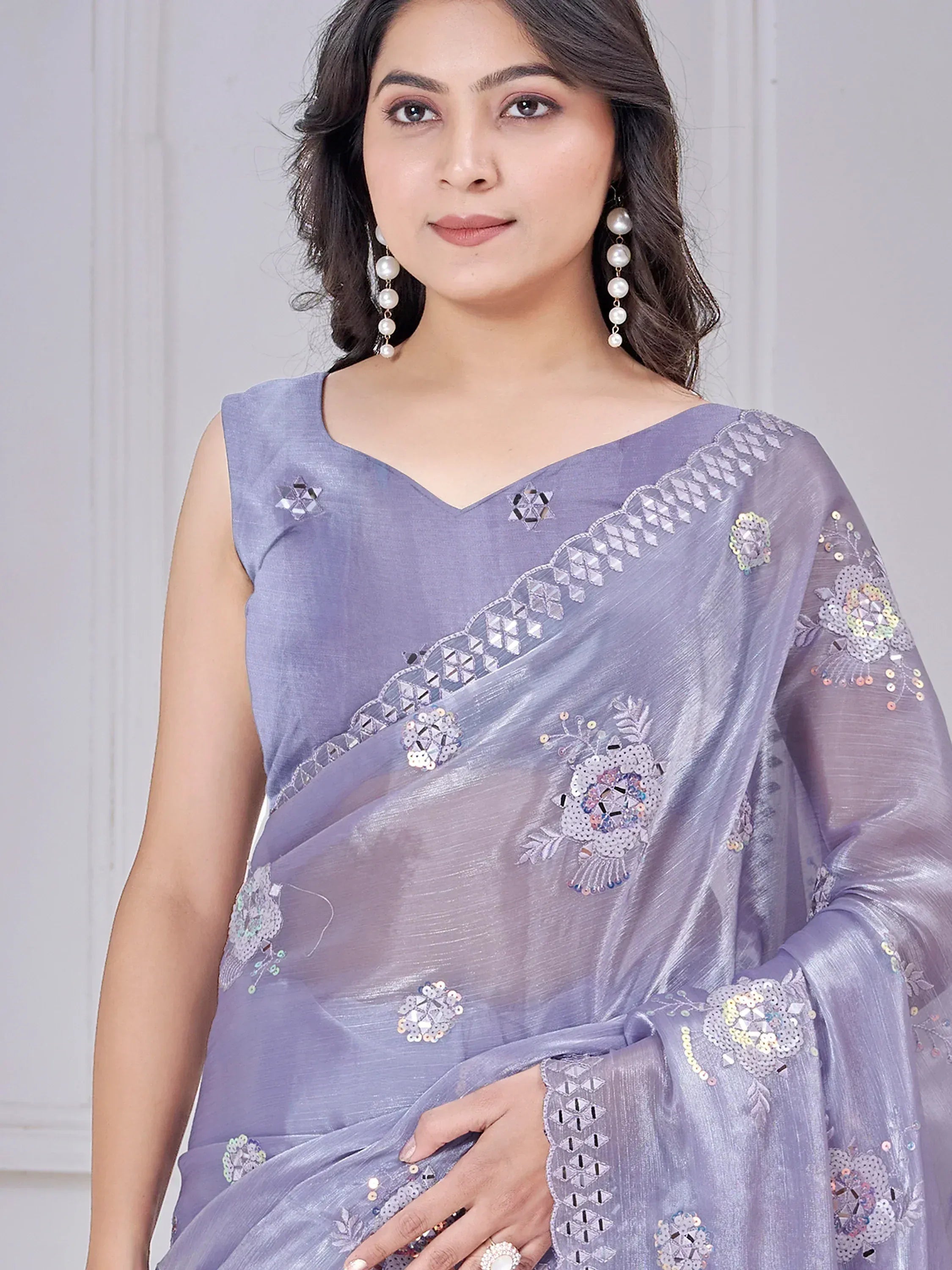 Lavender saree with floral mirror and sequin embroidery, perfect for Indian ethnic wear occasions.
