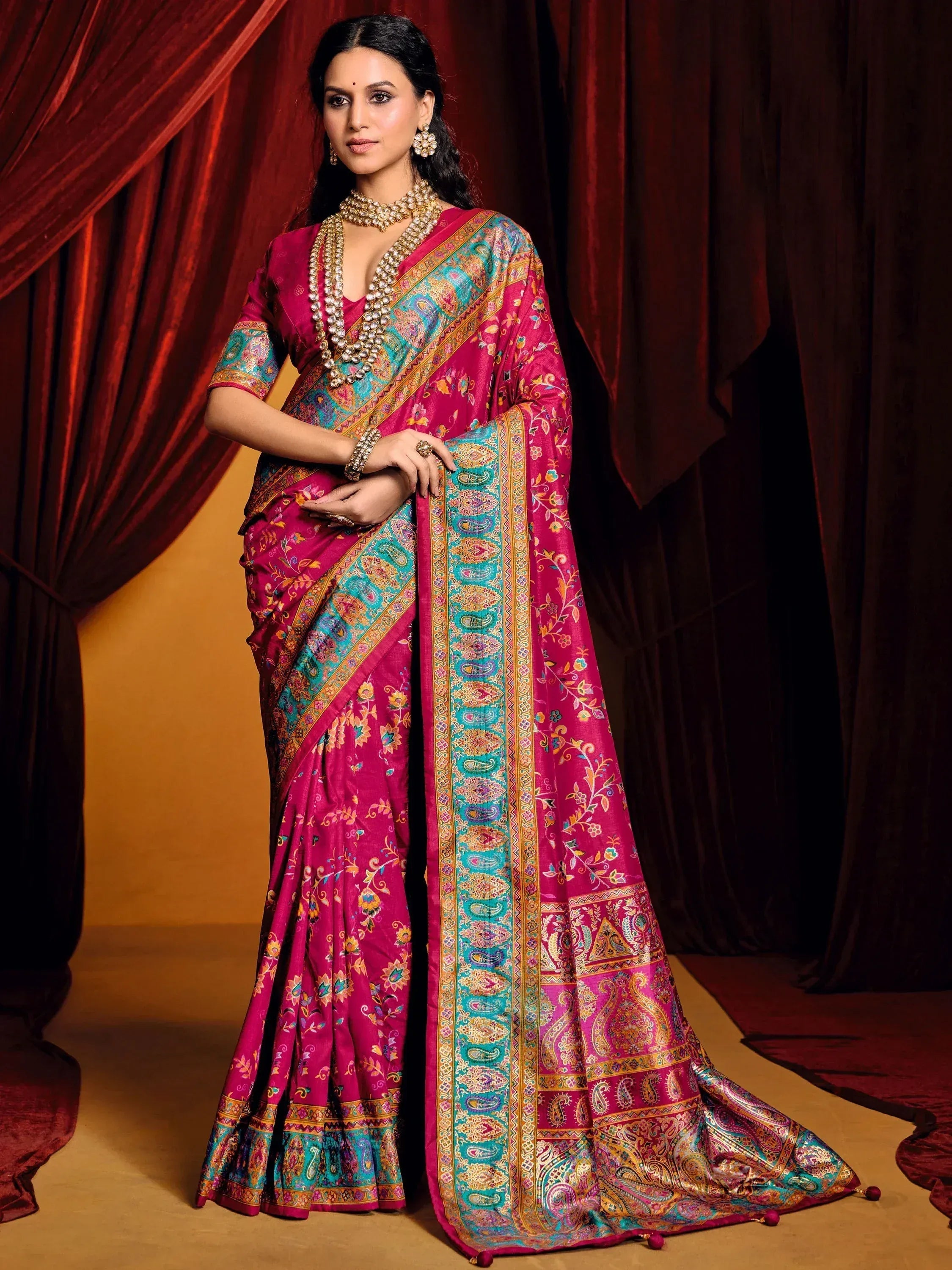 Elegant pink and teal designer saree with intricate paisley print, perfect for Indian ethnic wear occasions