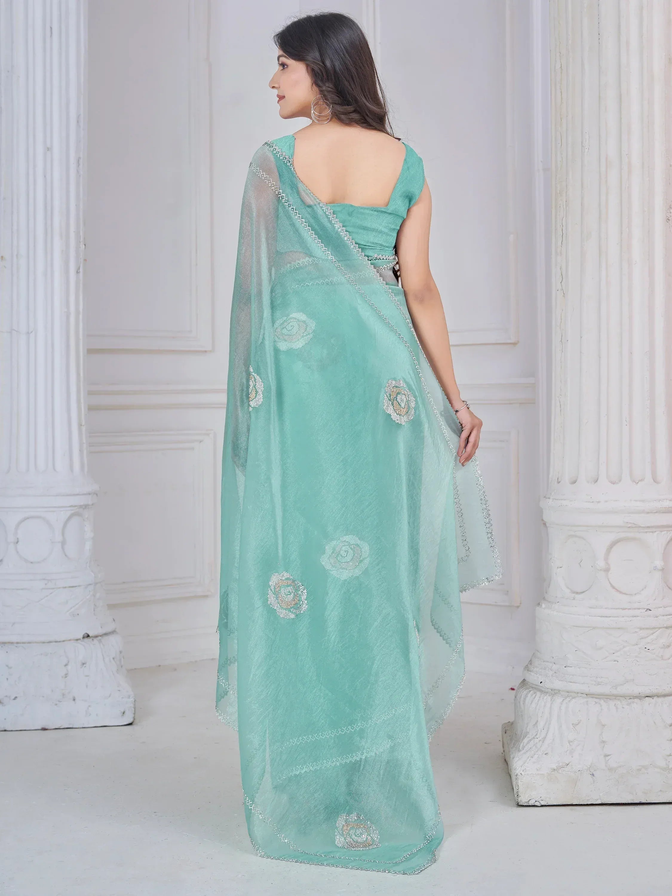 Mint green saree with floral embroidery and silver border, elegant ethnic wear for women