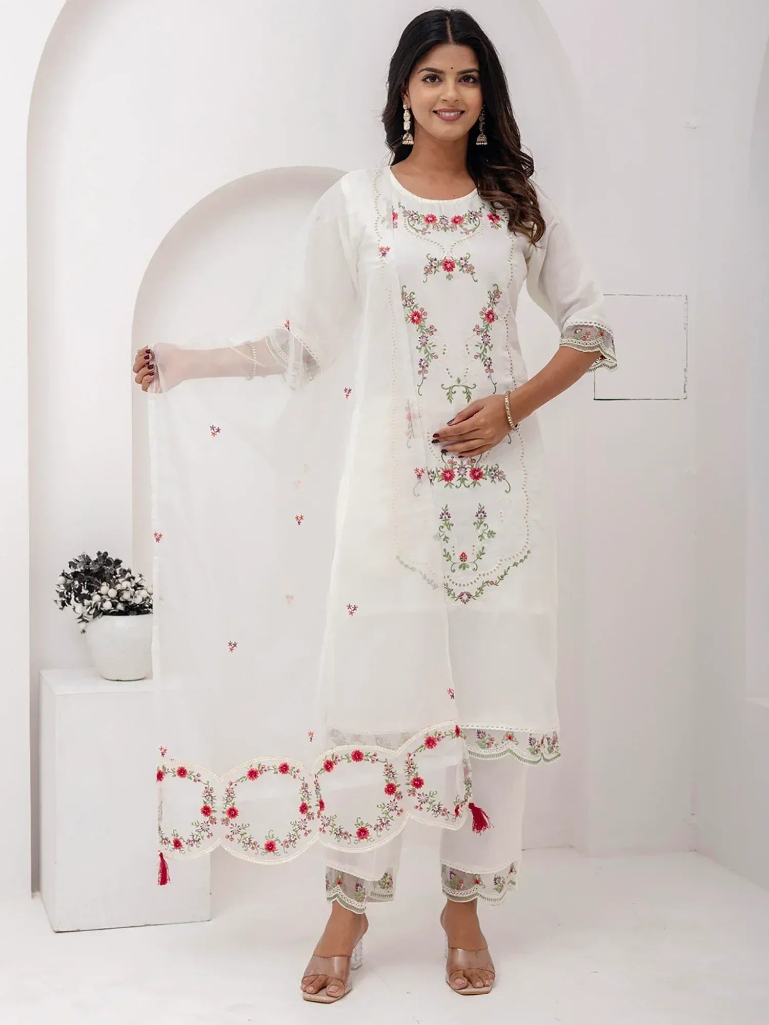 White embroidered salwar kameez with floral design, perfect for ethnic wear and festive occasions