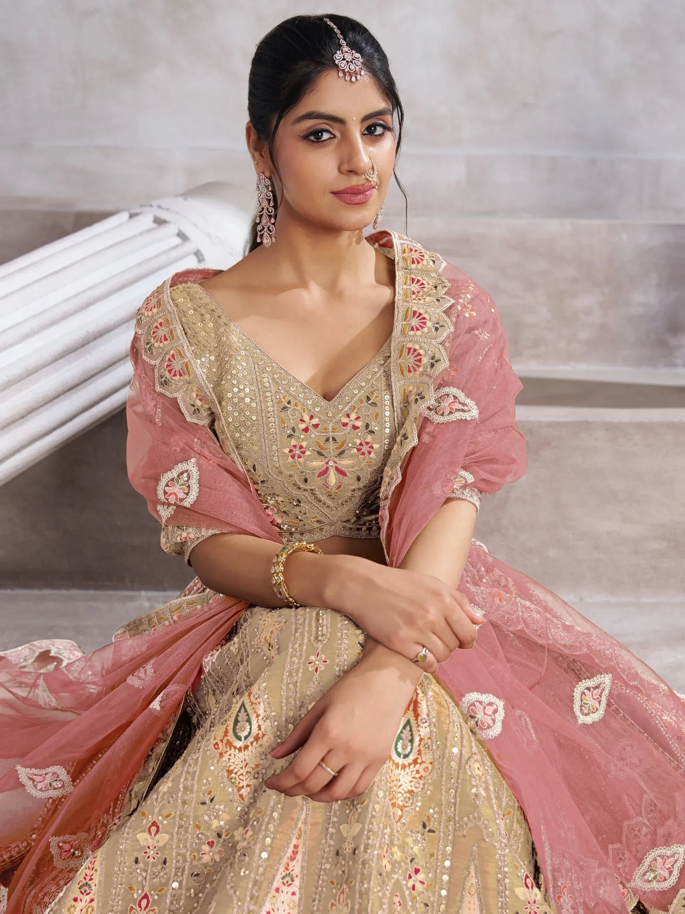 Elegant Indian bridal lehenga choli with floral embroidery and pink dupatta, perfect for weddings and celebrations