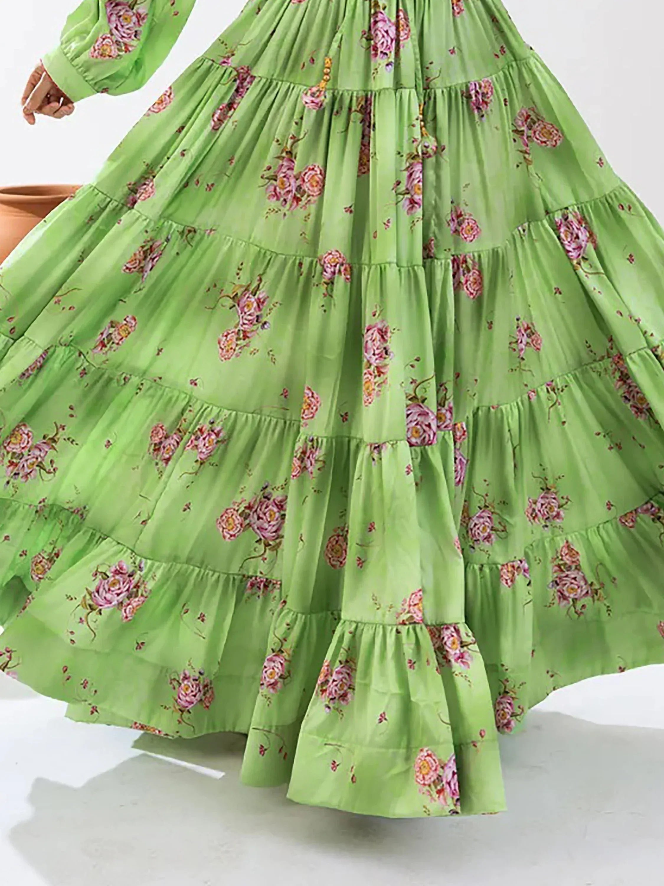 Green floral tiered ethnic gown with long sleeves, perfect for festive occasions and Indian wear.