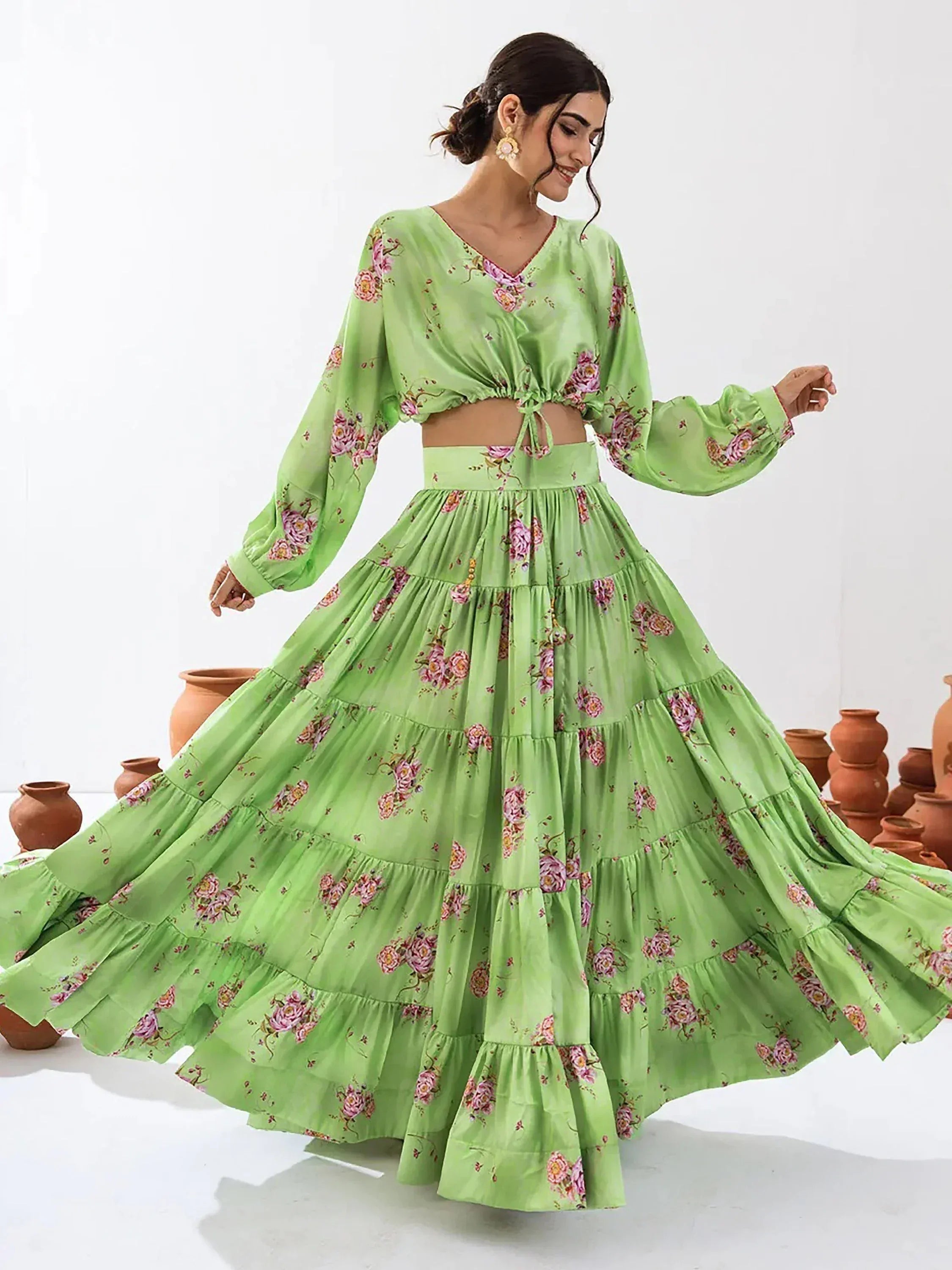 Green floral lehenga choli with tiered skirt and long sleeves, perfect for ethnic occasions