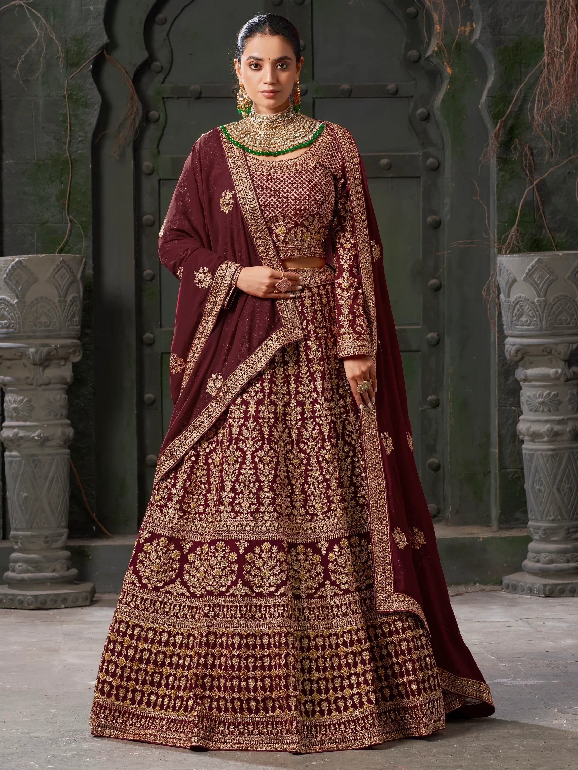 Maroon designer lehenga choli with gold embroidery, perfect for weddings and ethnic events