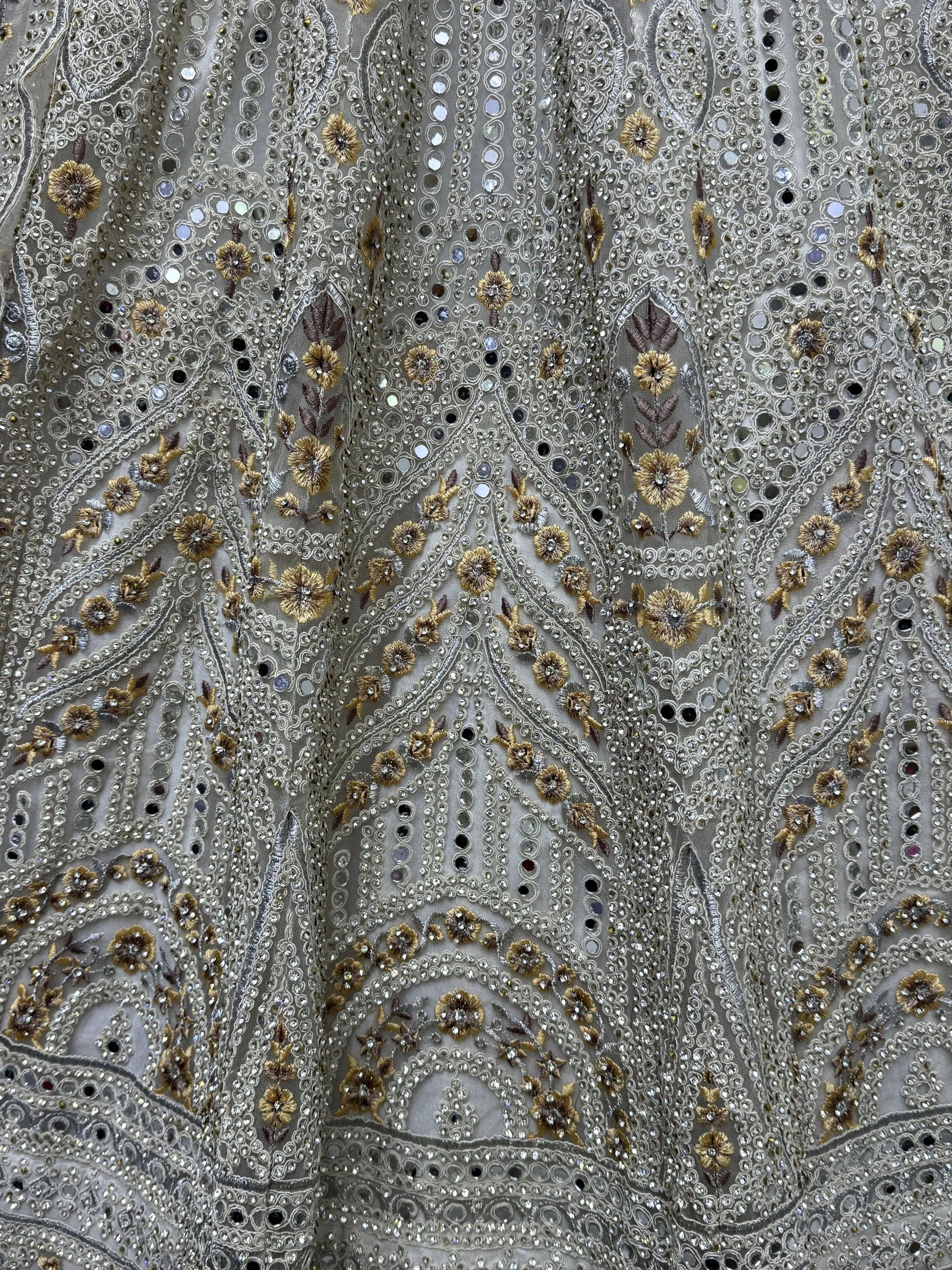 Silver and gold embroidered ethnic gown with floral sequin detailing, perfect for Indian weddings and festive occasions.