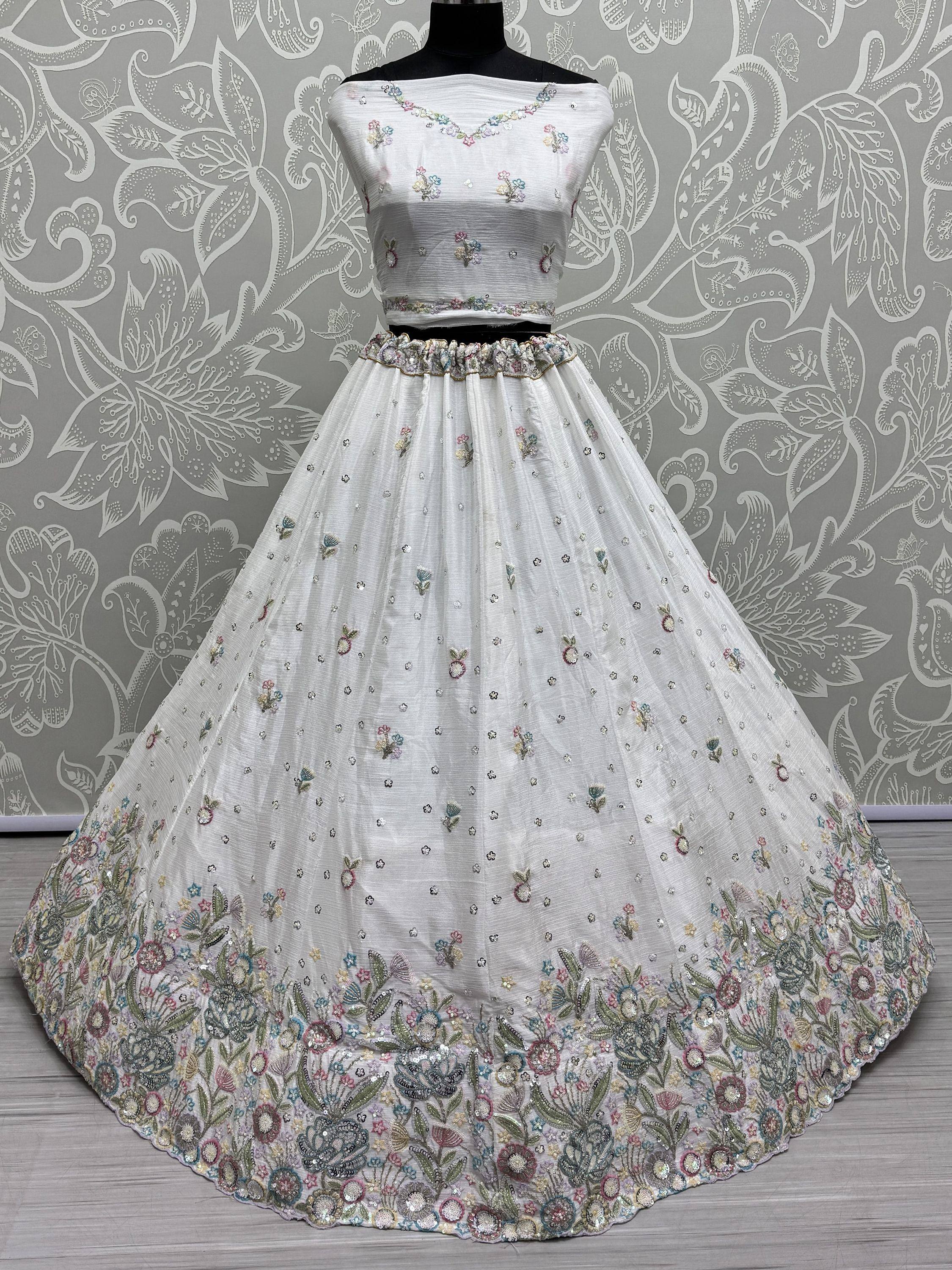 White floral embroidered lehenga choli with off-shoulder blouse, perfect for Indian ethnic occasions