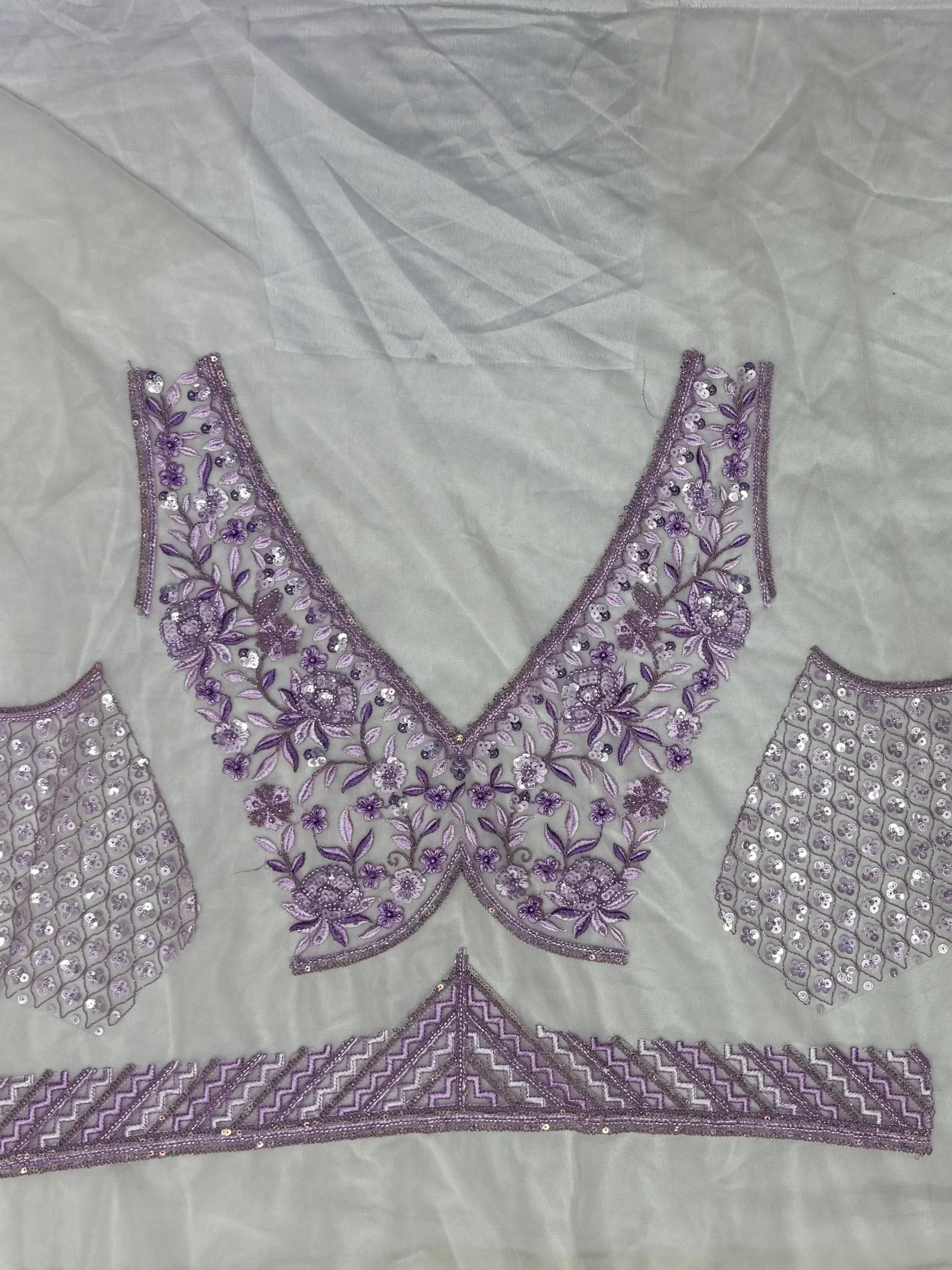 Purple floral embroidered lehenga choli blouse with sequin detailing and V-neck design
