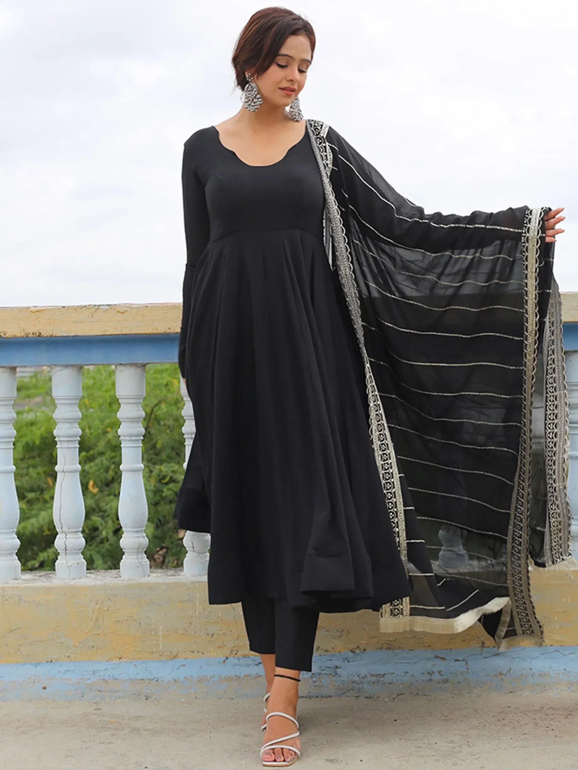 Black ethnic anarkali suit with silver embroidered dupatta, perfect for Indian occasions