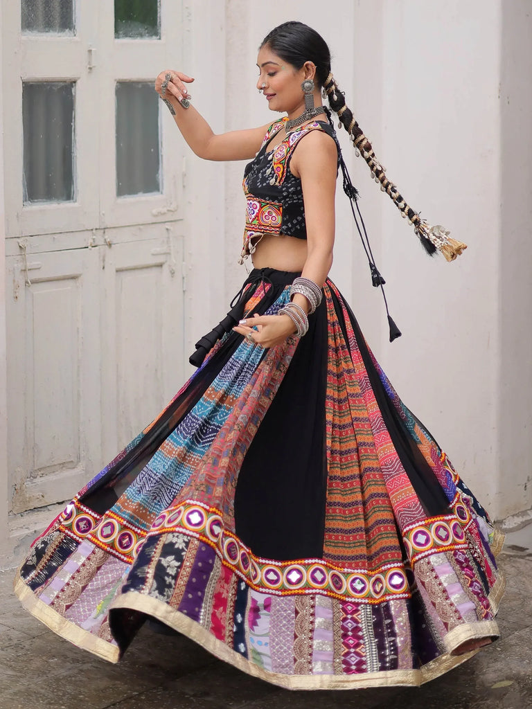 Woman in colorful embroidered lehenga choli with mirror work, traditional Indian ethnic wear