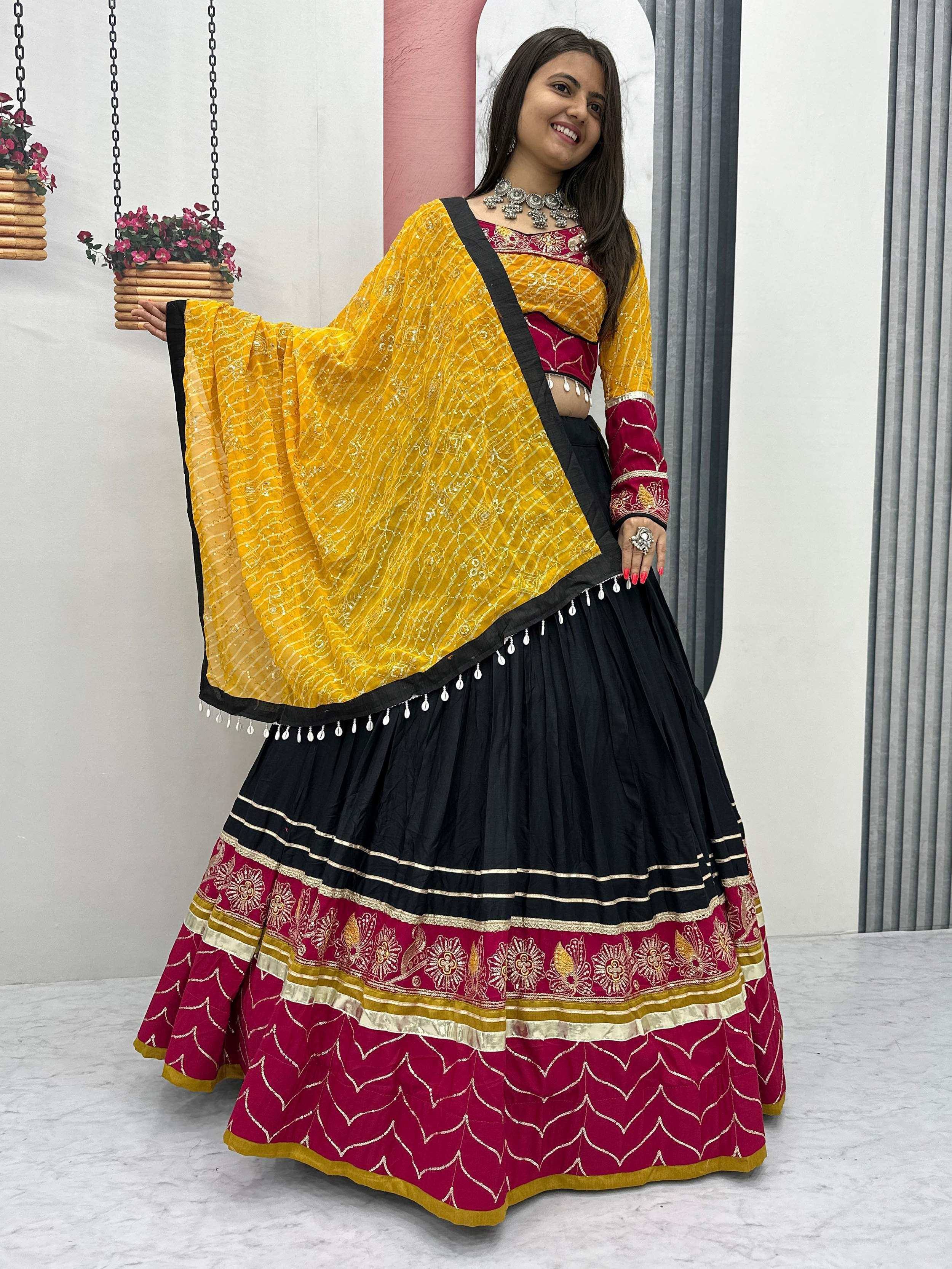 Yellow and maroon embroidered lehenga choli with black skirt, perfect for Indian ethnic wear occasions